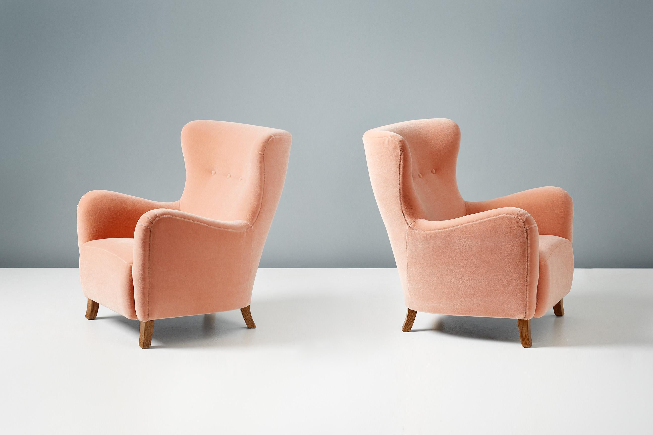 Dagmar Design

Sampo Wing chair. This obscure design originated from the workshop of little-known Copenhagen upholsterer Christian Sorensen in the early 1940s.
These examples are upholstered in a peach-pink Mohair velvet from Pierre Frey, Paris with