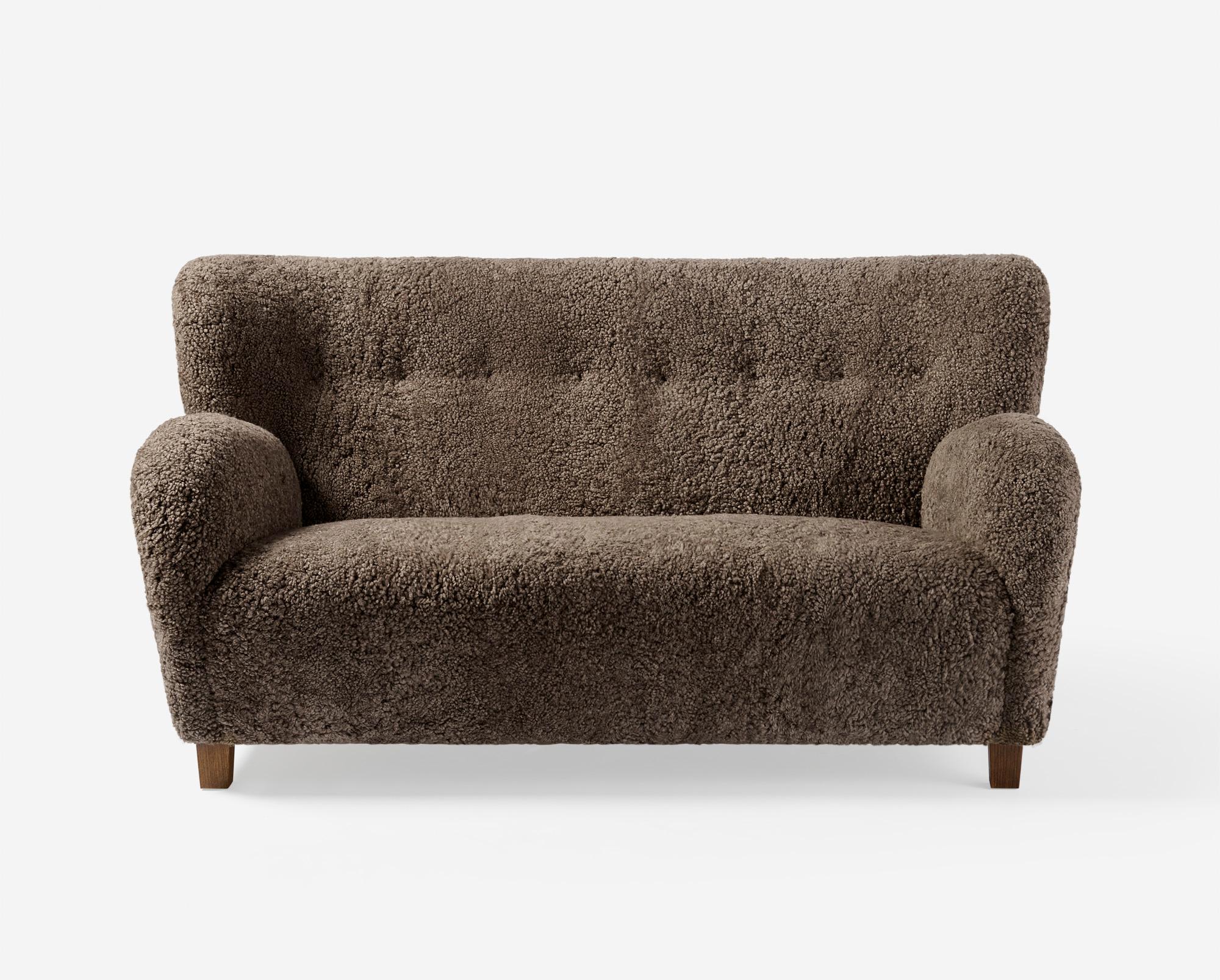 The Karu Sofa is a contemporary update of a classic design first produced in Finland by the Haimi Oy company in the 1940s. The inviting curved arms and subtle winged back are the epitome of the post-war Nordic aesthetic. Karu offers perfect