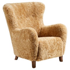 Chaise Wing sur mesure en peau de mouton