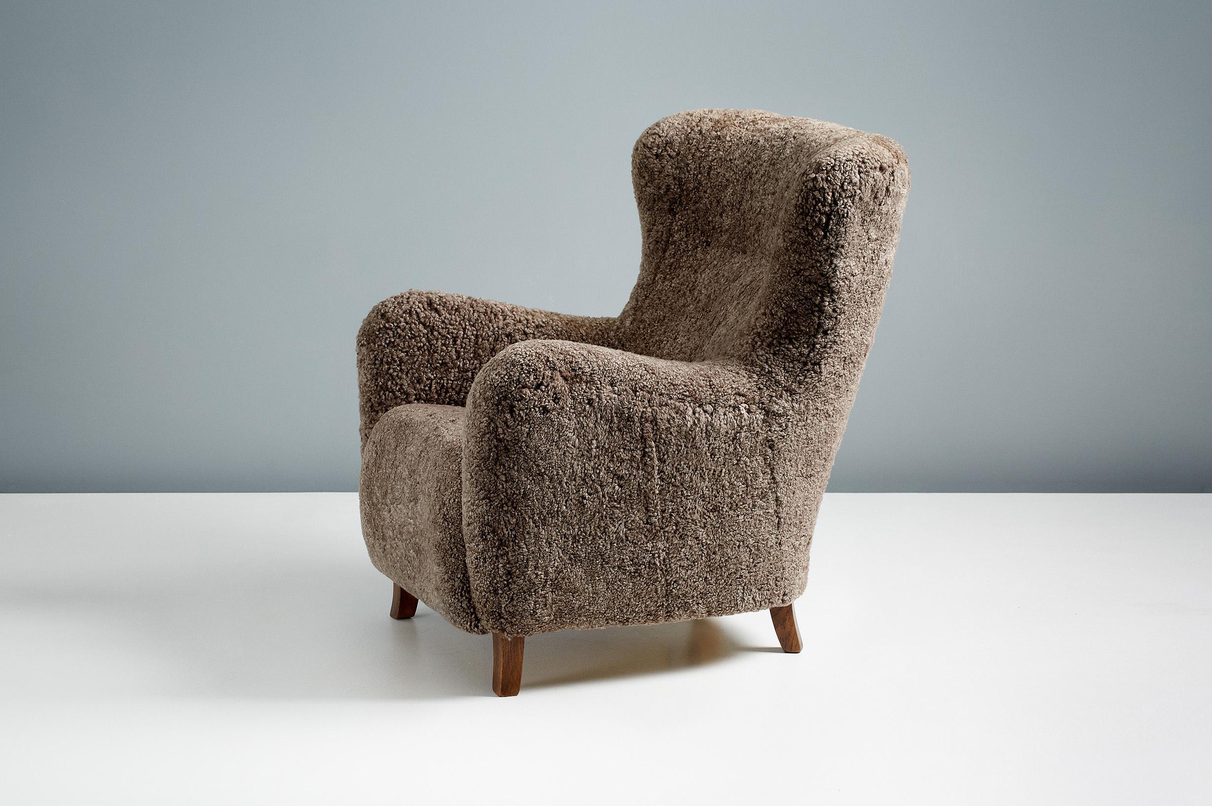 Dagmar - Sampo Wing Chair & Ottoman

A custom-made wing chair and ottoman developed & produced at our workshops in London using the highest quality materials. The frame is built from solid beechwood with a sprung seat. The Sampo chair is available