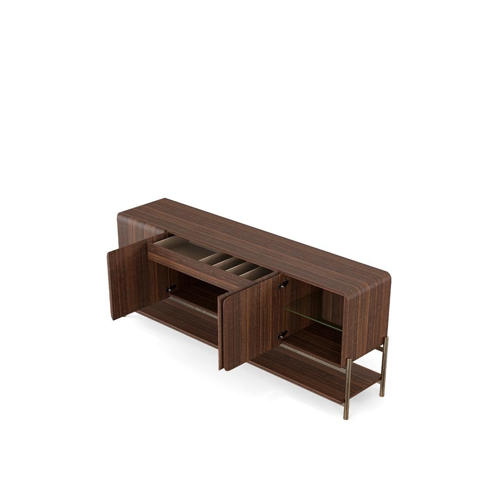 Smooth, curved, and distinctly contemporary, this capsule-shaped sideboard features a softly rounded silhouette that brings a sense of quiet sophistication to any interior. The body is finished in a warm matte lacquer, offering a velvety surface