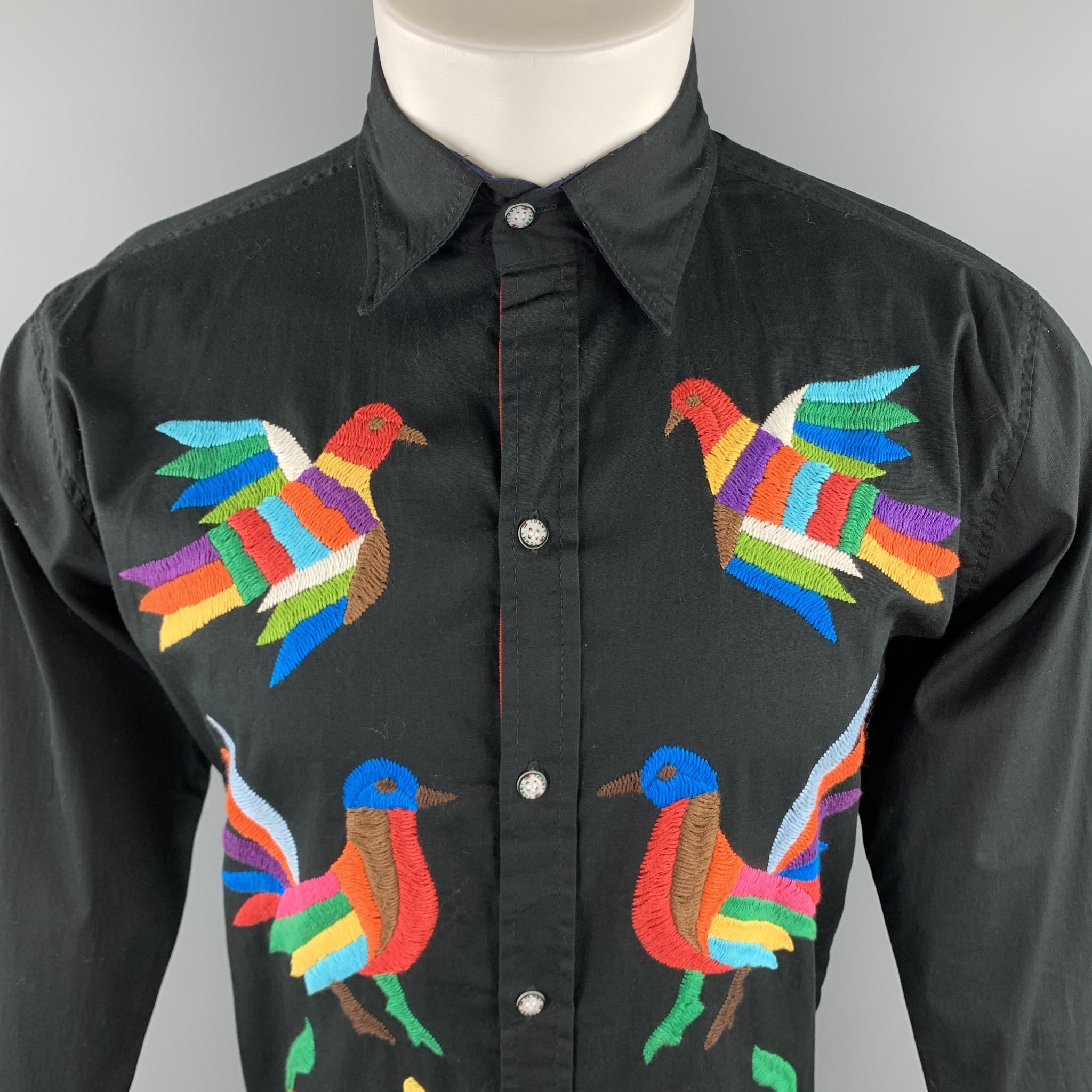 CUSTOM MADE long sleeve shirt comes in a solid black cotton material, featuring multi color custom embroideries at front, a classic collar, button up. With Tommy Hilfiger buttons and striped trim. 

Excellent Pre-Owned Condition.
Marked:no