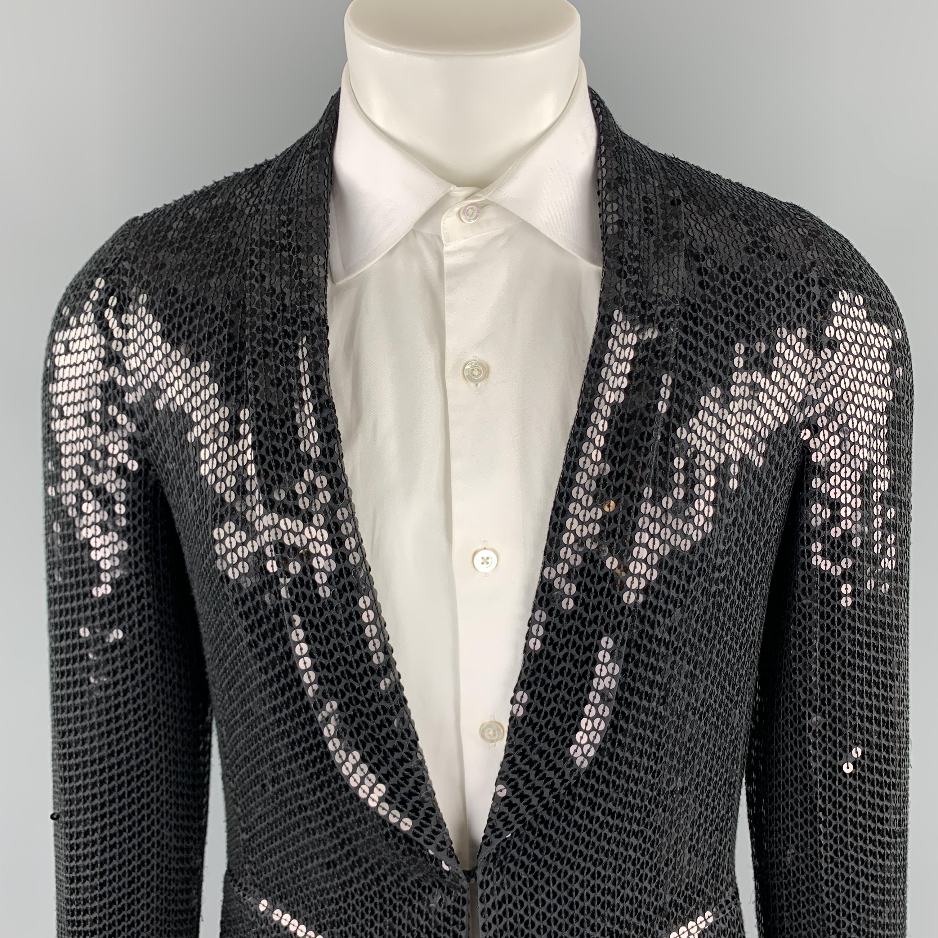 CUSTOM MADE sport coat comes in a black sequined silk material, featuring a shawl collar, a hook and eye at closure, flap pockets, single breasted, and unbuttoned cuffs. As is. 

Excellent Pre-Owned Condition.
Marked: no