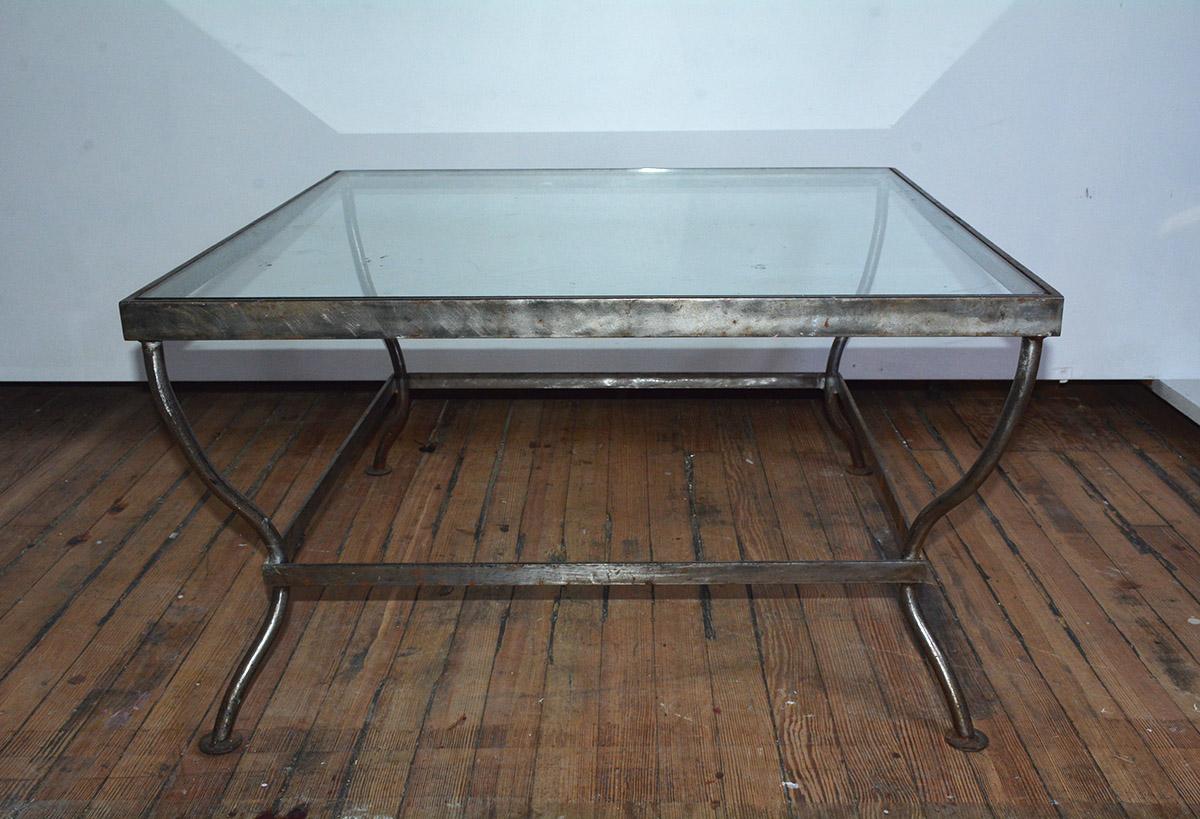 Custom made to size, Mid-Century Modern Industrial style glass and polished iron coffee table. Can be made to customer specification. Similar design available in dining table or side table versions. 
Table can support stone, wood or glass. Other