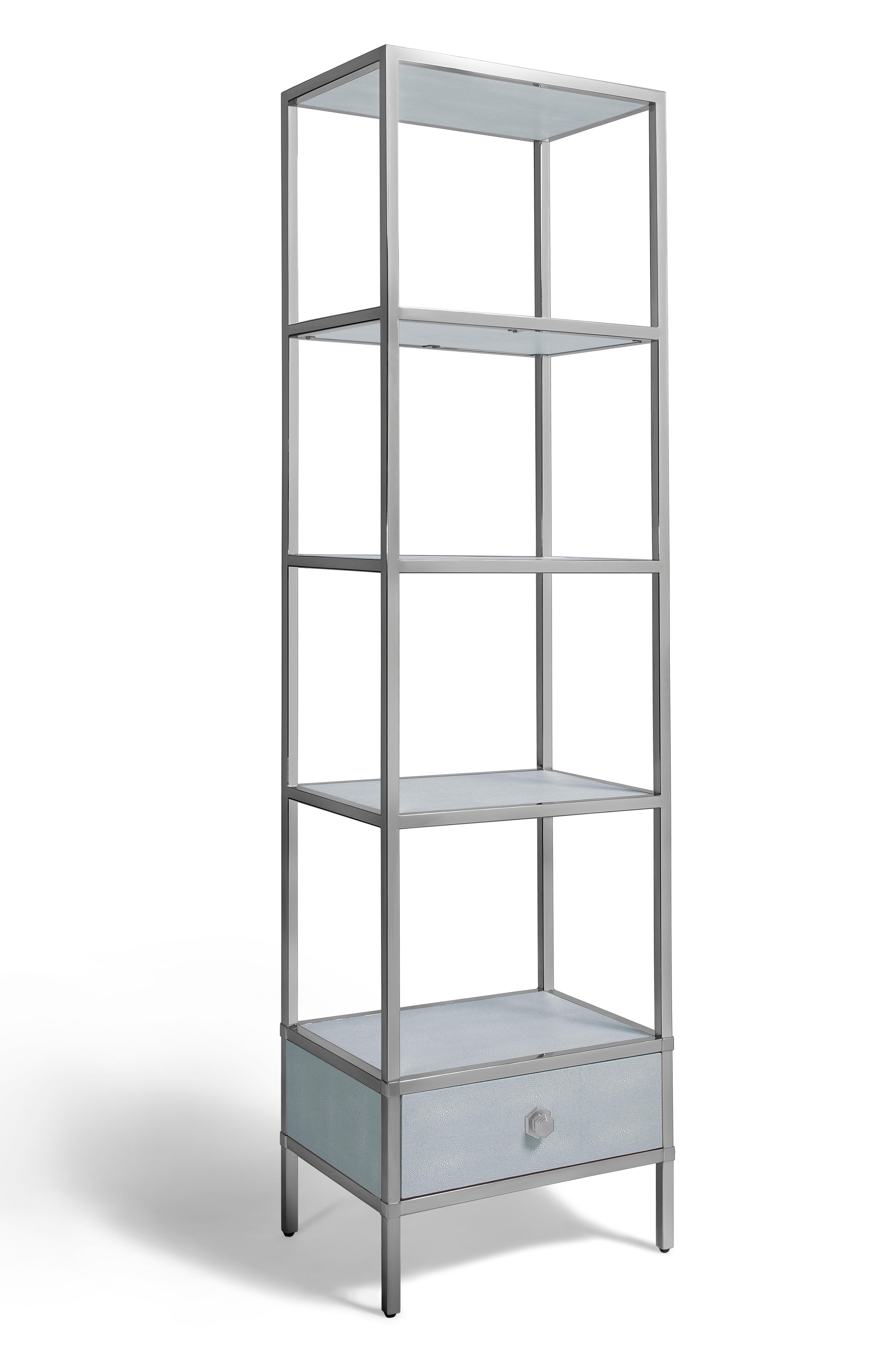 The single standing shelf was custom made to the clients specifications which were as follows. 

A polished stainless steel shelf frame with four shelfs consisting of shagreen inserts into the frame and a shagreen draw at the base with an Oak