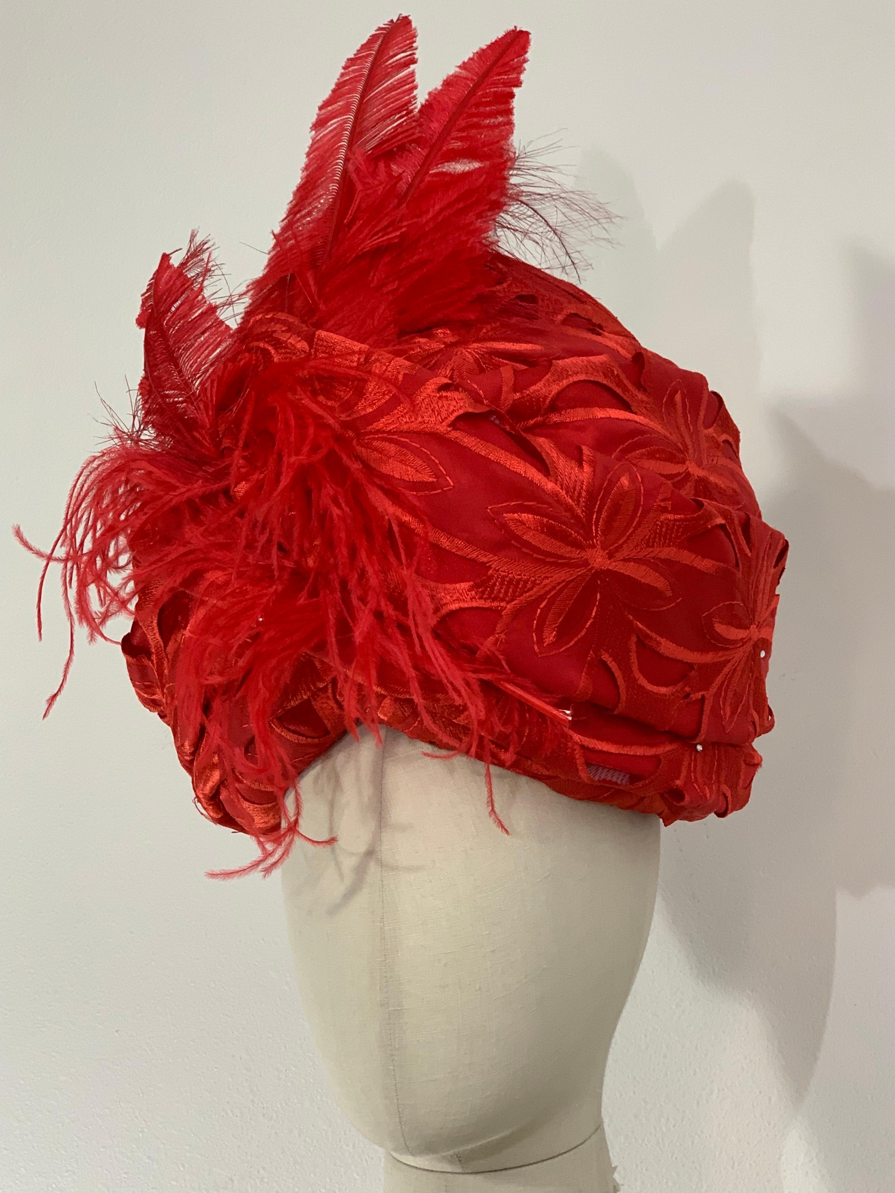 Custom Made Suzanne Couture Millinery Cardinal Red Silk Eyelet Cut-Out  Embroidered Lace Tufted and Padded Turban w Matching Ostrich Feather Flourish at Front.  Lace is dotted with tiny scattered rhinestones. Lined in red silk. Inner combs for