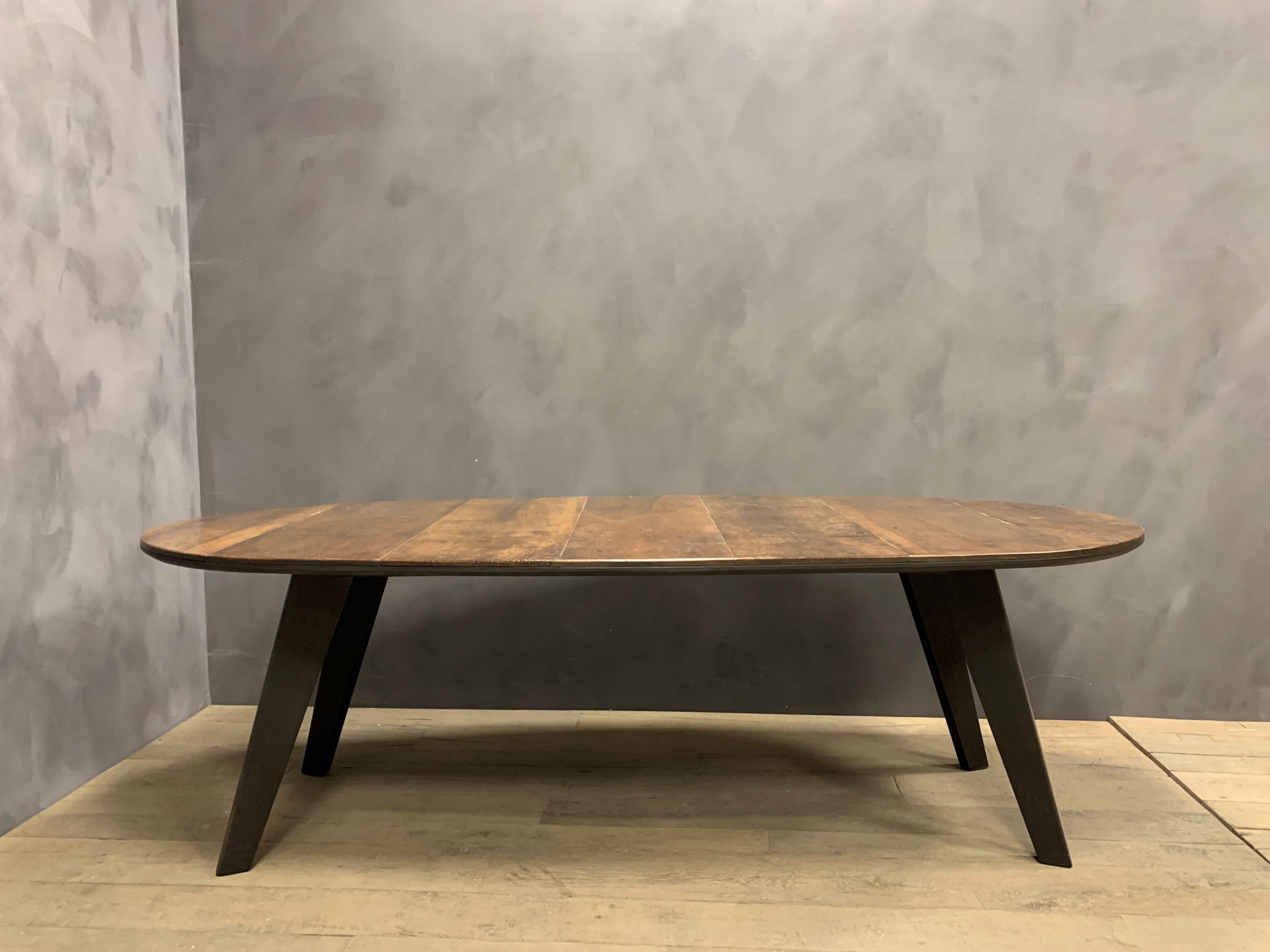 Ou custom made dining table BIL. Inspired by modernist design we combined 18th century Italian walnut with burned oak supports. Please note that the materials we use are never the same as they are handpicked for their compability with each other. So