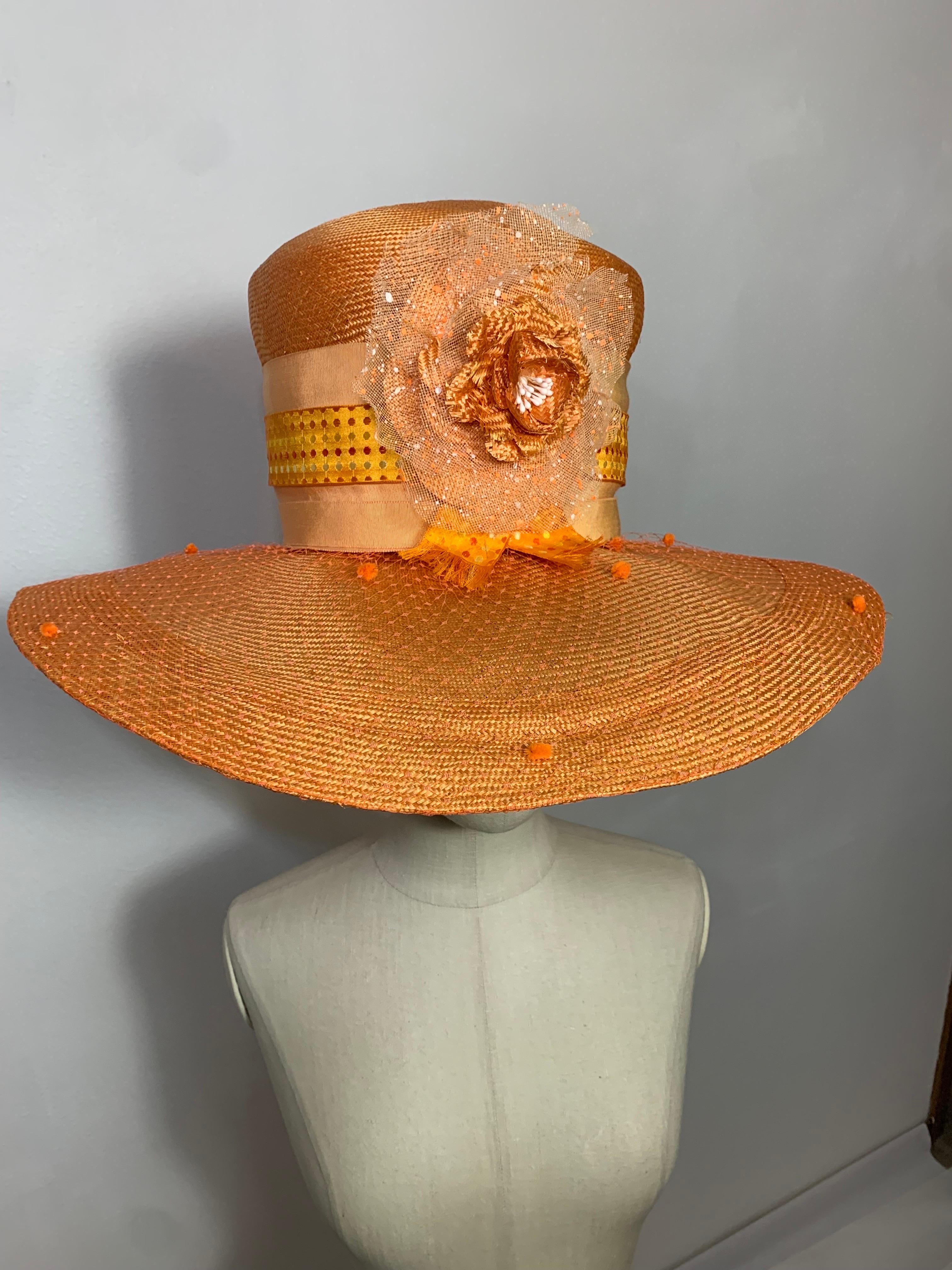 Custom Made Tangerine Straw Wide Brim Hat w Flower Embellishment and Veiled Brim: Suzanne Couture Millinery crafted this stunning hat in an unusual shade with textured ribbon banding and brim wrapped in chenille dotted veiling. Brim measures 19