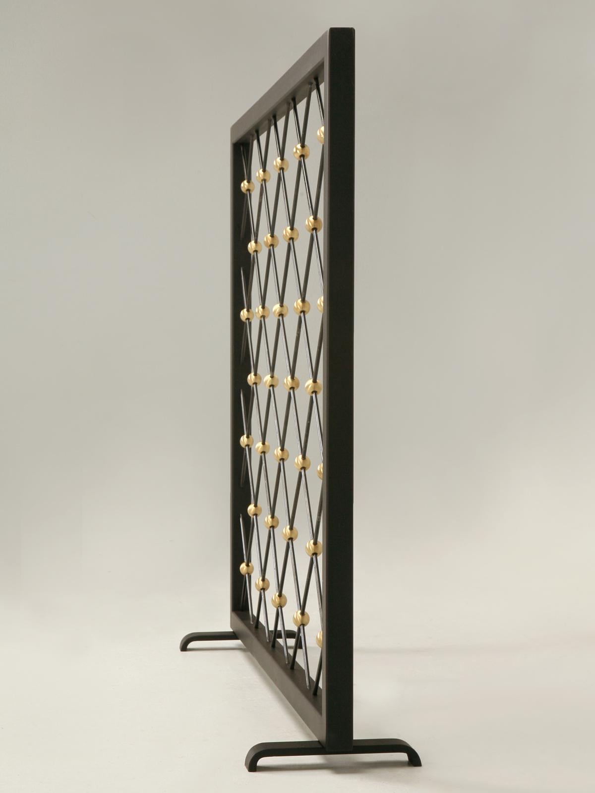 Heavy steel and brass Mid-Century Modern style fireplace screen, that our old plank workshop builds to order in your specific dimensions and finish. We also custom build other Mid-Century Modern fireplace screens and all are listed on 1stdibs.