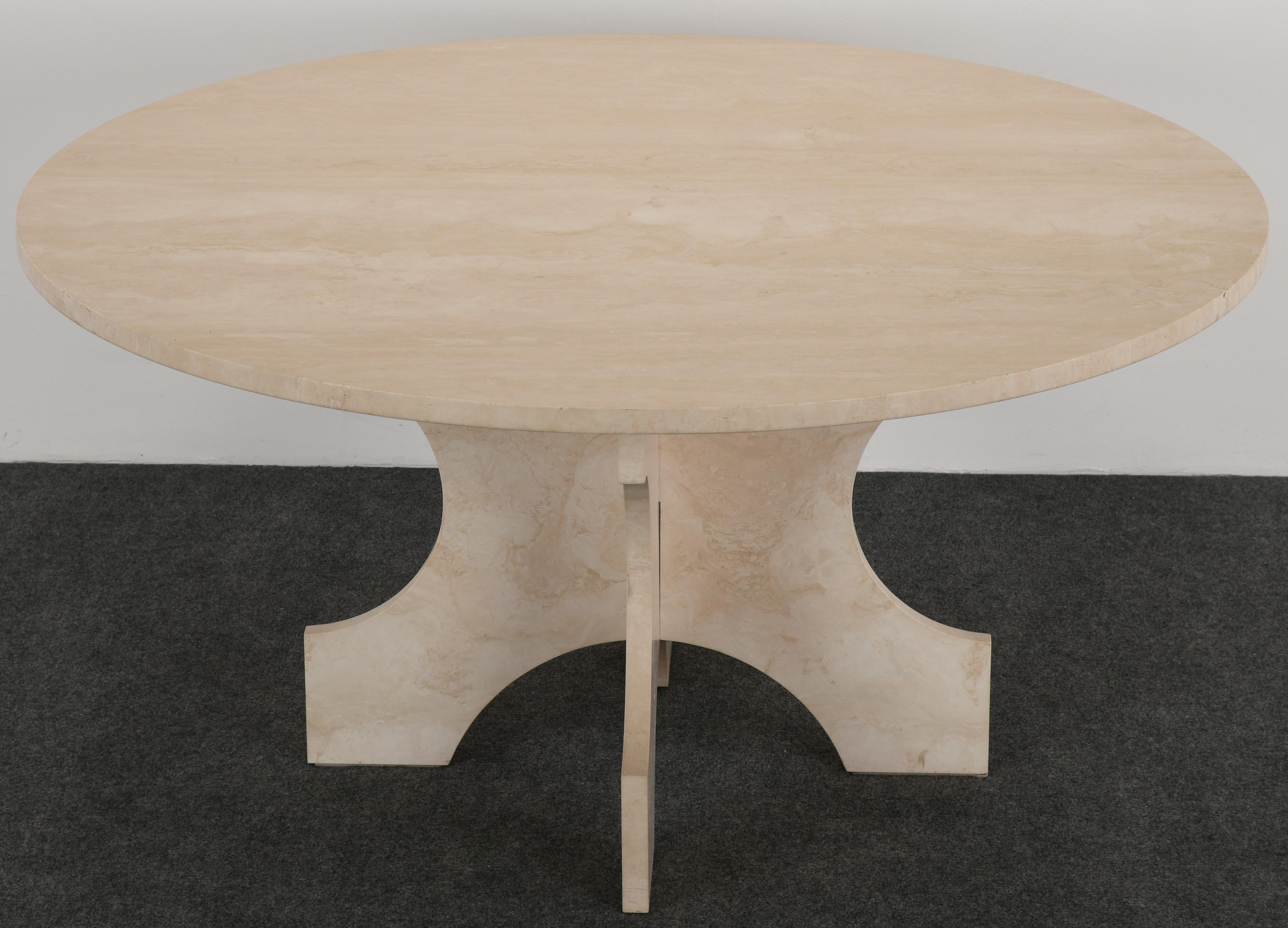 A stunning custom made Travertine Dining Table by Balsamo Antiques, 20th Century. This minimalist table has an x-leg base with a matte or honed finish and one inch thick top. It assembles in three pieces and is in very good condition.