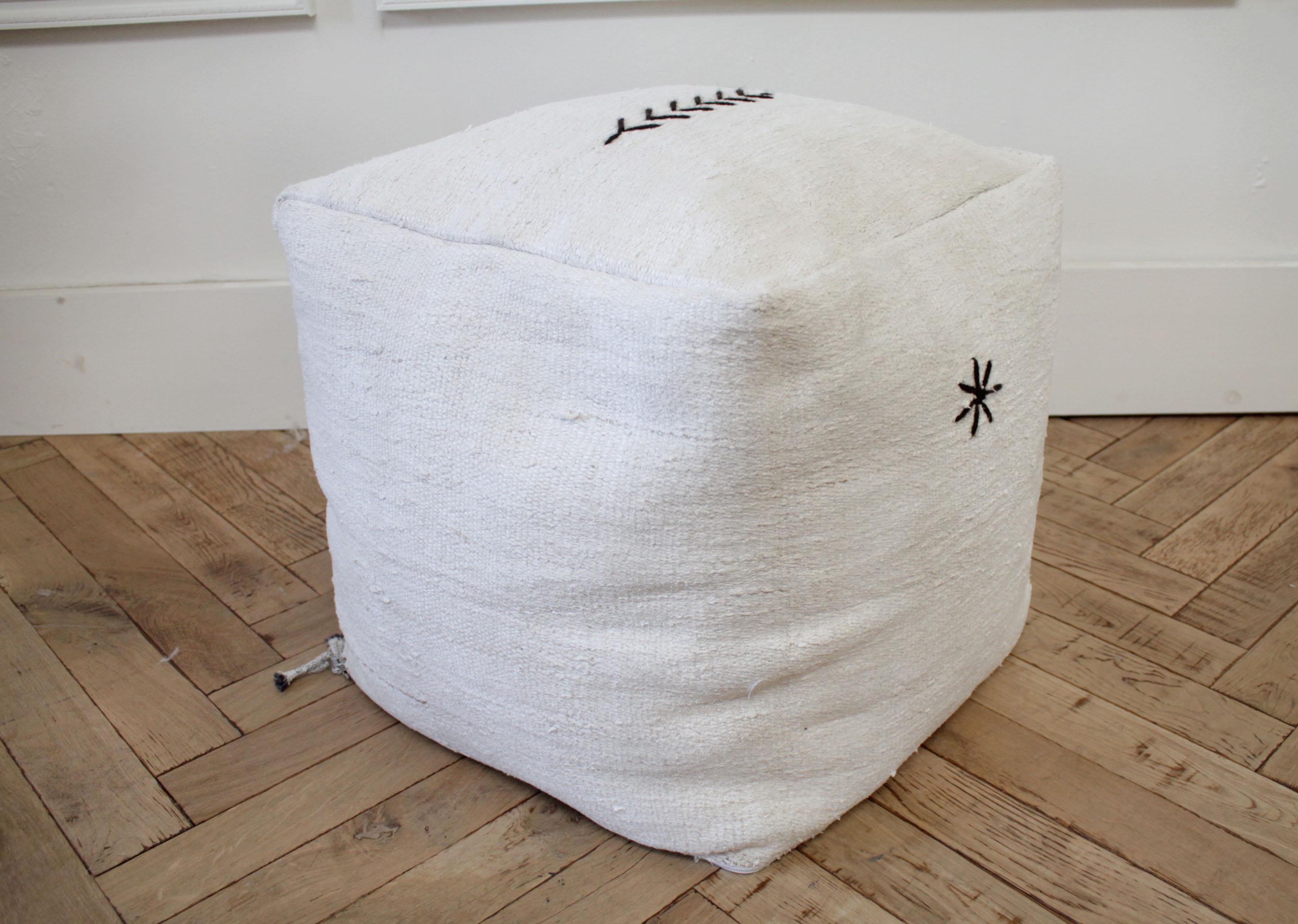 Custom made vintage woven rug cube Pouf Ottoman
A soft white rug with original stitched zig zag and star. Zipper closure on the bottom, can be washed. This is a nice nubby thick rug, with stuffed foam beans, it does not fall flat when you sit on