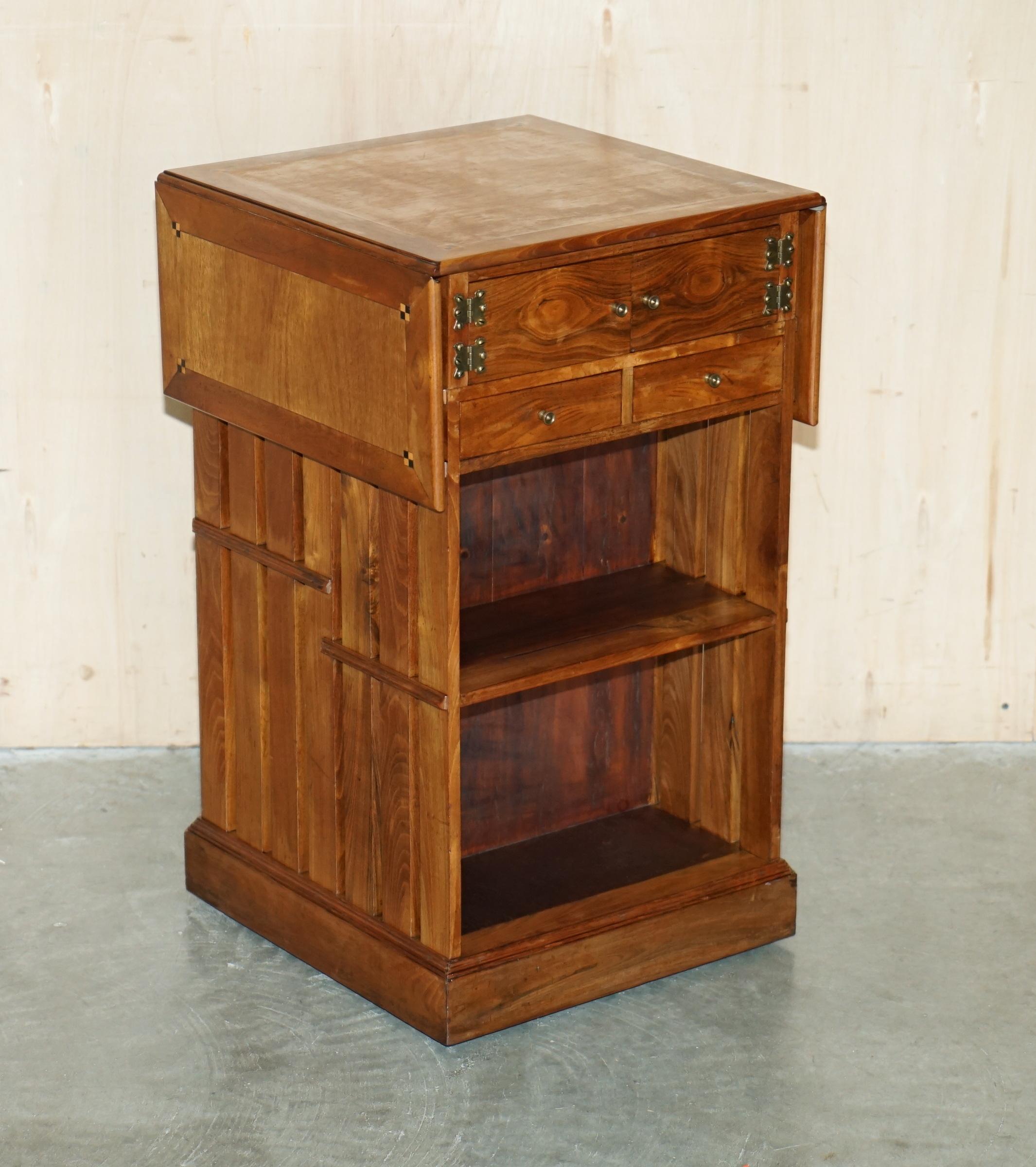 Royal House Antiques

Royal House Antiques is delighted to offer for sale this super decorative one of a kind, custom made English Walnut with Boxwood inlay, Extending bookcase table with drawers and cupboard 

Please note the delivery fee listed is