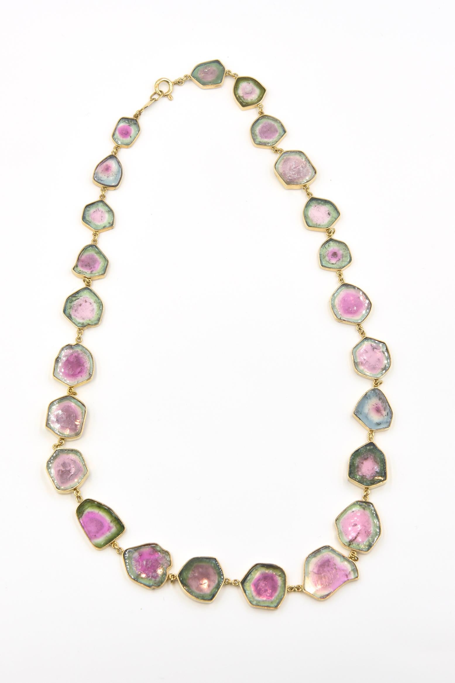 Beautifully made to feature this collection of watermelon tourmaline, each stone is surrounded by a 18k yellow gold hand made bezel then linked together and then terminating in an 18k jump ring clasp.  The necklace contains over 100 carats of