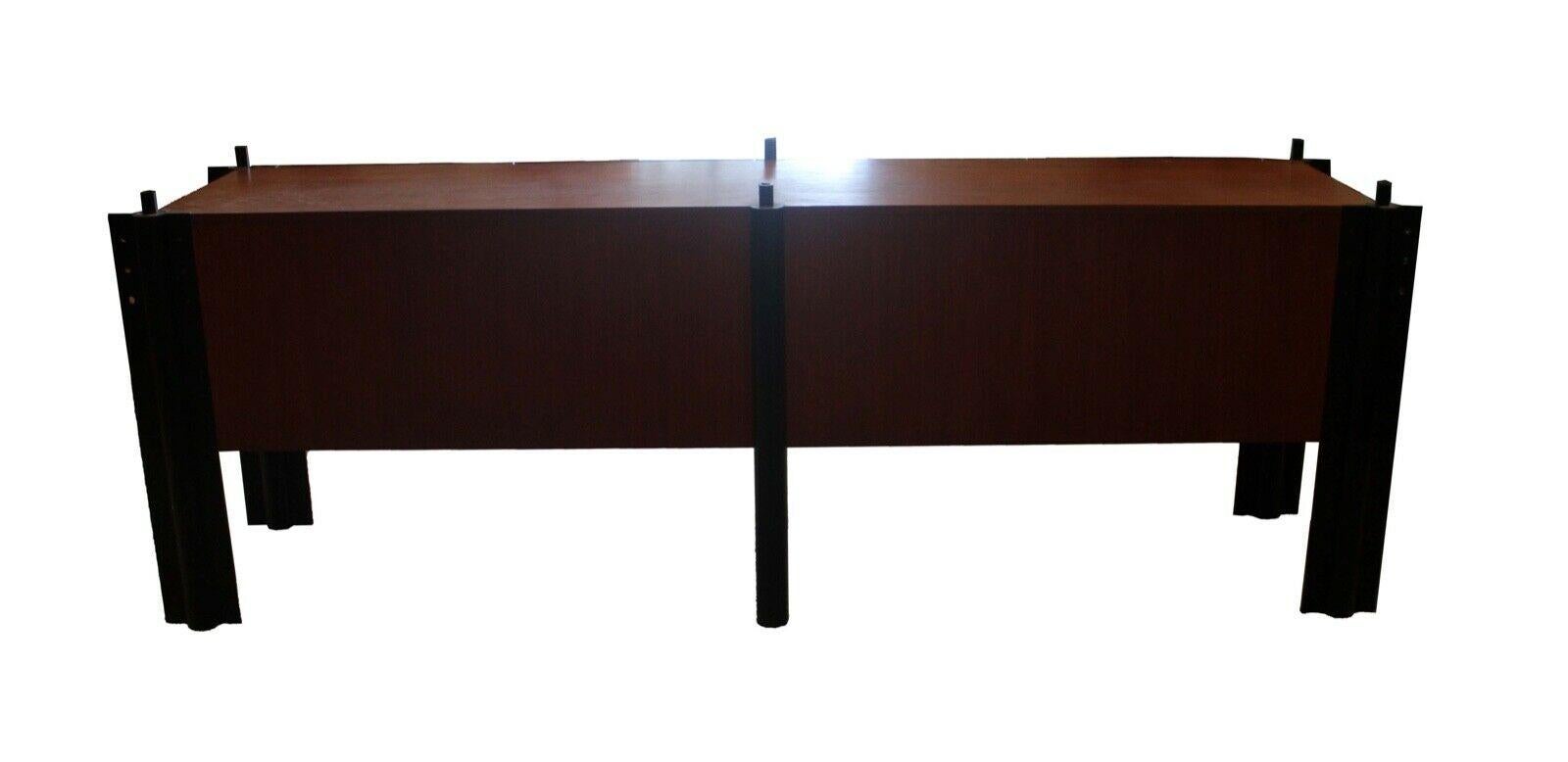 One of a kind monumental custom made solid walnut credenza with beautiful granite top and memphis style steel black metal legs. Includes 2 drawers and 2 shelfs. Truly amazing and in excellent condition. Dimensions: 109 W x 23 D x 34.5 H.
