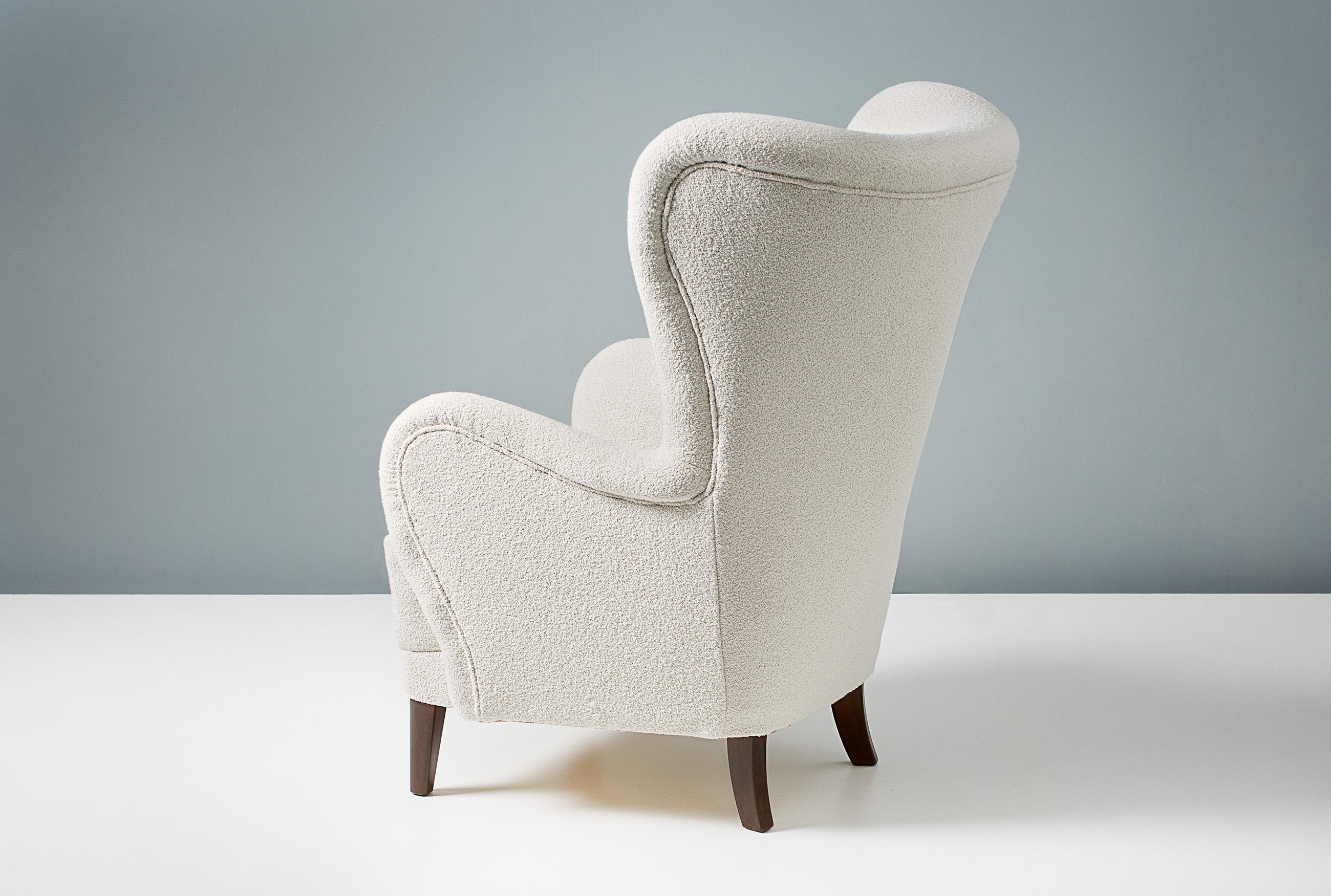 A custom-made wing chair developed & produced at our workshops in London using the highest quality materials. The frame is built from solid tulipwood with a fully sprung seat. This example is upholstered in Chase Erwin ‘Embrace’ boucle fabric and