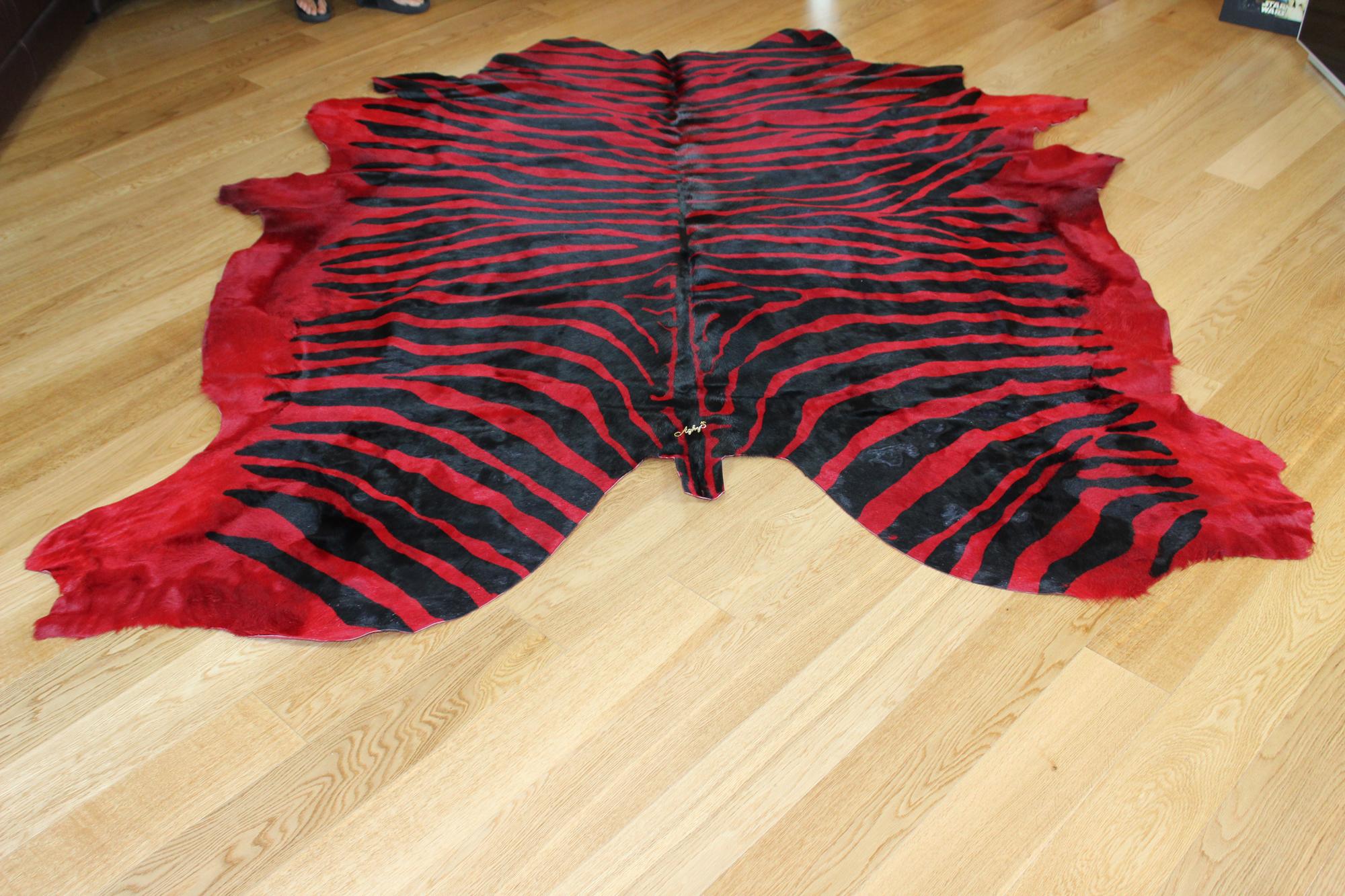Custom rugs manufactured in Italy.
The item listed is a black and red zebra cow leather rug, ready for shipment.
Size: 5,20mq

Custom orders ready for shipment in 10 days.