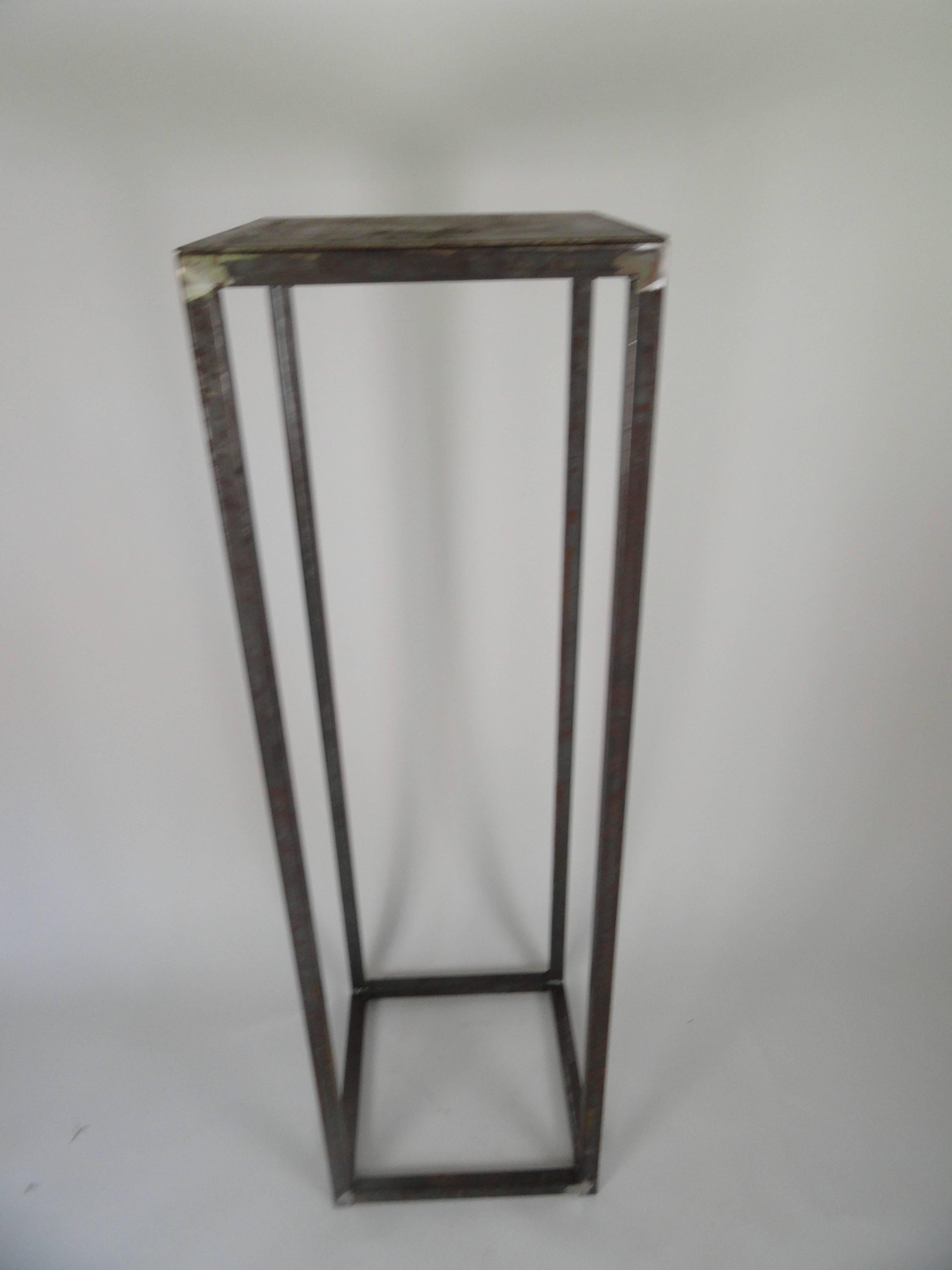 This is a custom metal pedestal in a natural finish. It is designed to hold and display that special object. The contrast between a glass or wood object looks fantastic. A pair would look wonderful on either side of a major doorway.
Custom sizes