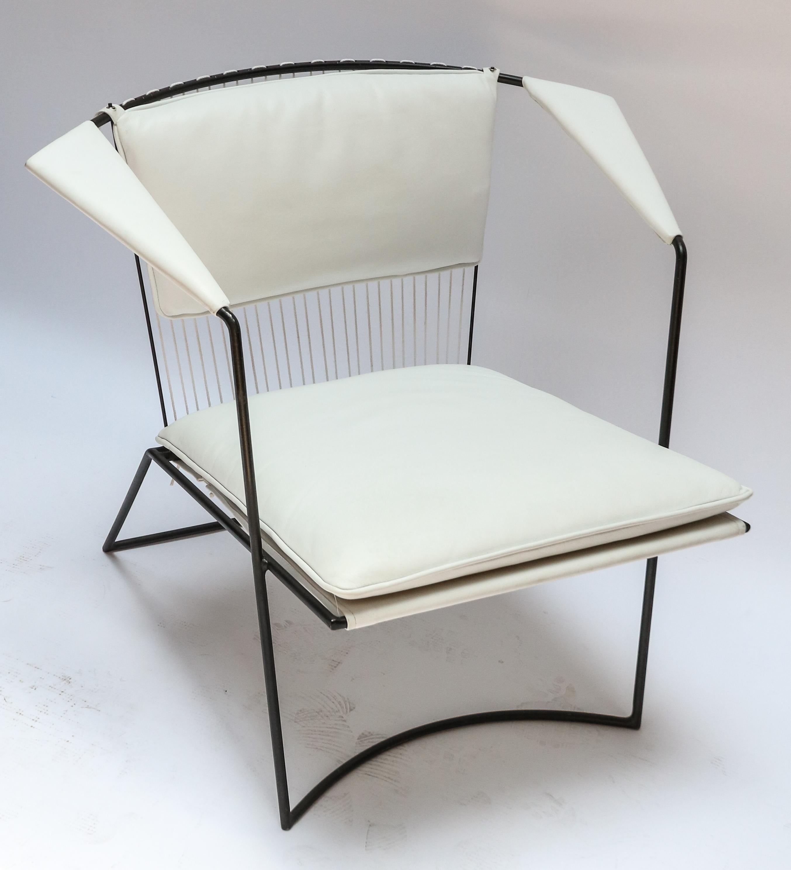 Custom metal armchairs in the style of Tenreiro upholstered in white leather by Adesso Imports.
Seat dimensions: 21.5? W x 22? D.