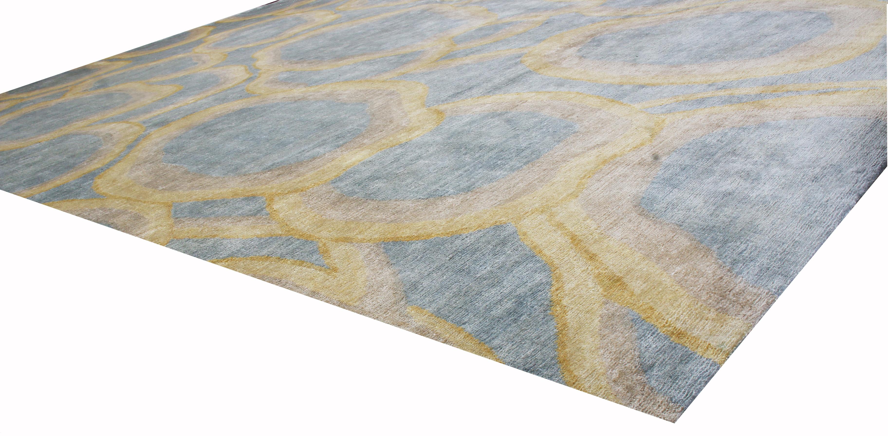 Rug & Kilim’s “Bubbles” rug hails from its newly unveiled custom collection, featuring a lustrous, Abrash background of Industrial, metallic gray with titular golden-yellow bubbles in hand knotted Matka silk, available in full custom