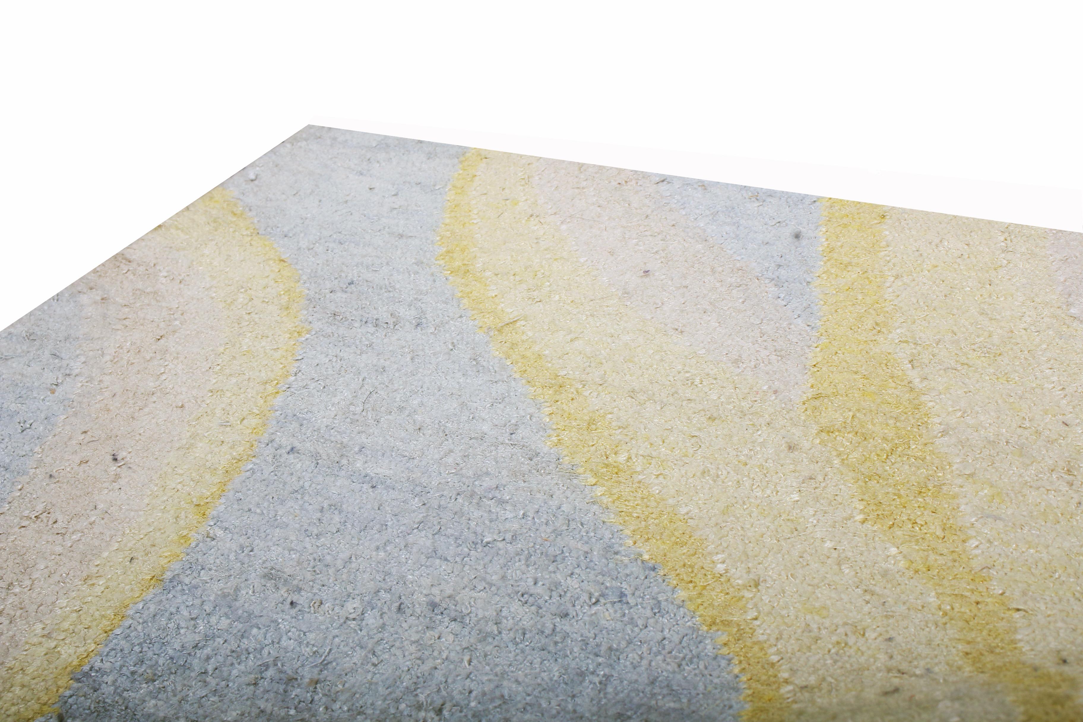 Rug & Kilim’s “Bubbles” rug hails from its newly unveiled custom collection, featuring a lustrous, Abrash background of Industrial, metallic gray with titular golden-yellow bubbles in hand knotted Matka silk, available in full custom sizes.
  