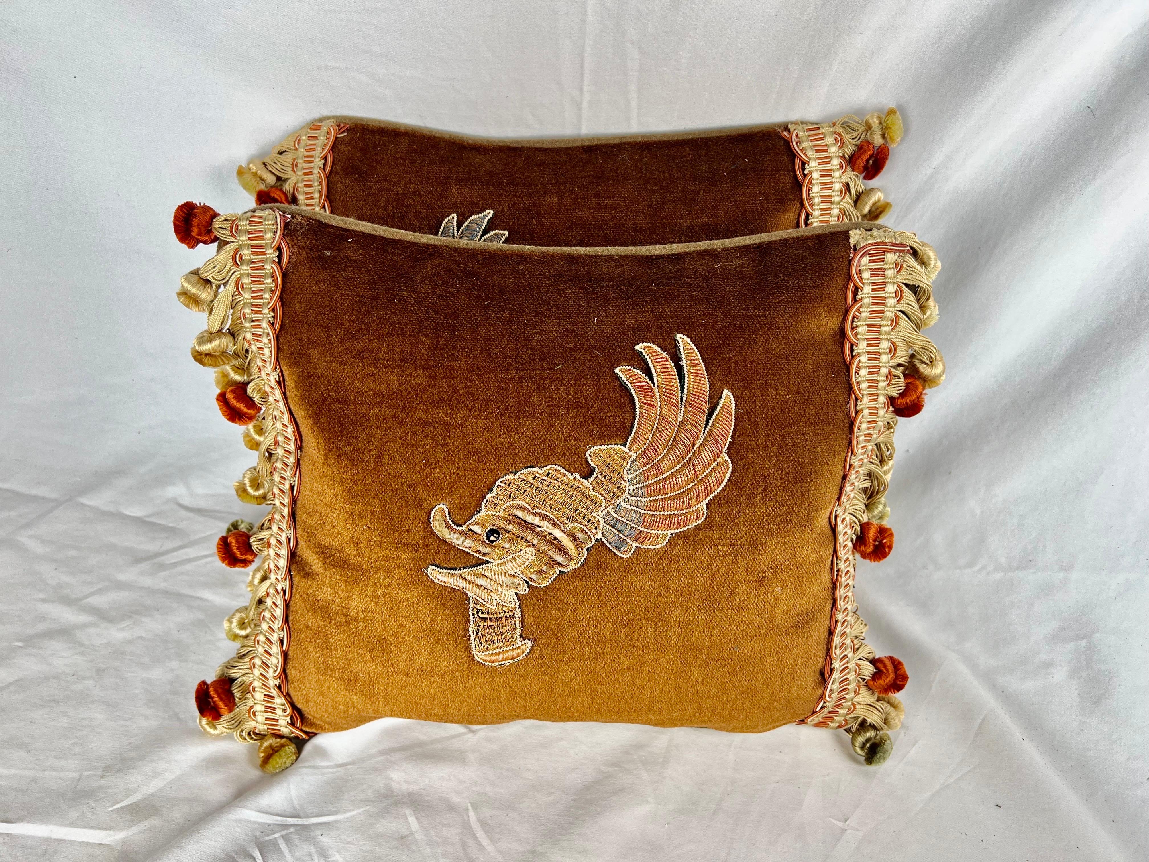 Pair of custom pillows made with 19th century metallic & silk embroidered appliques.  The appliques resemble an ostrich with feathers.  The fronts are a rust silk mohair and the backs a brown linen. Down inserts, zipper closures.