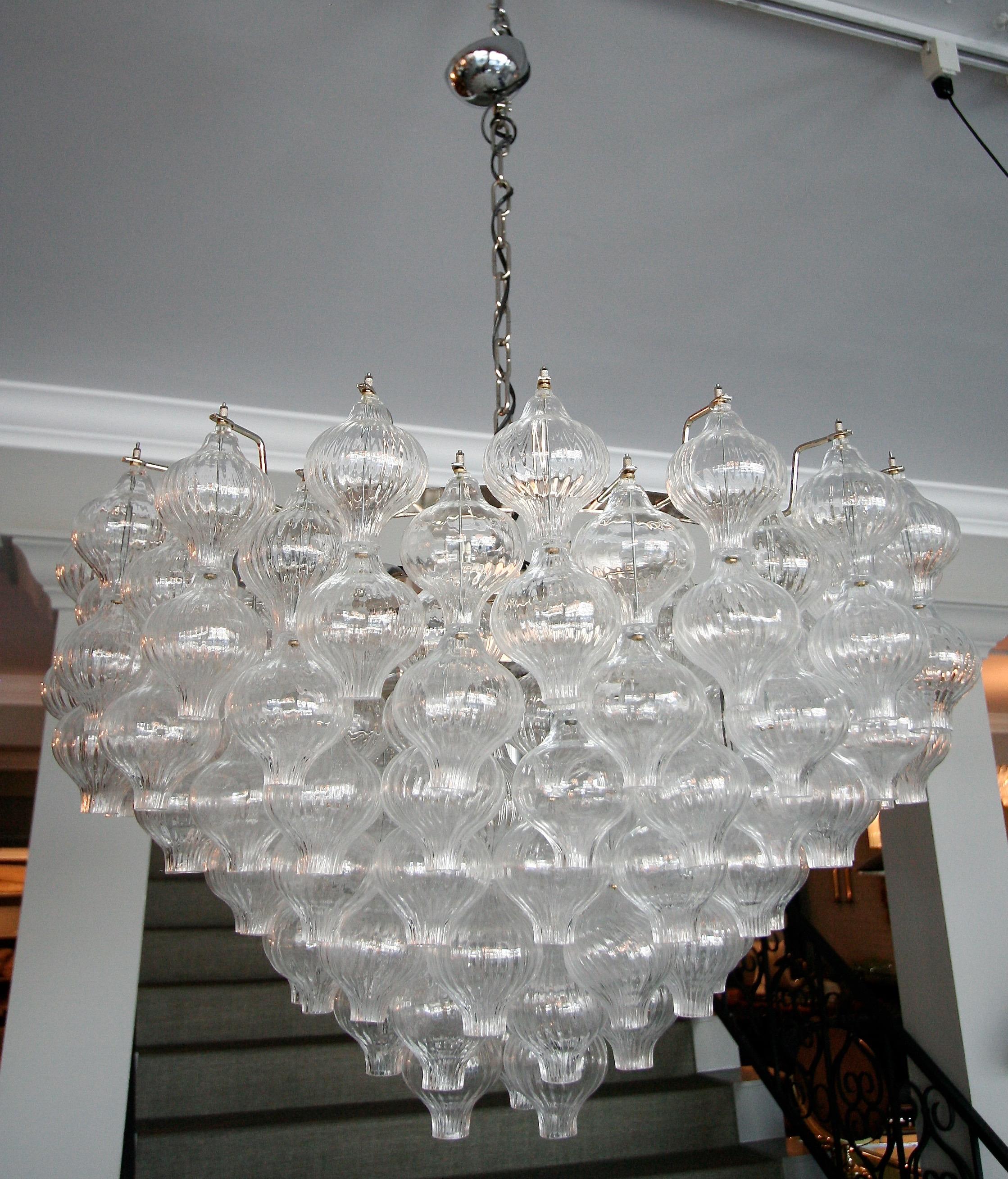 Custom midcentury style Murano clear glass chandelier with 95 double glass tulip shaped balls to make hourglass shapes with chrome frame. Can be done in different metals. Height with canopy 42