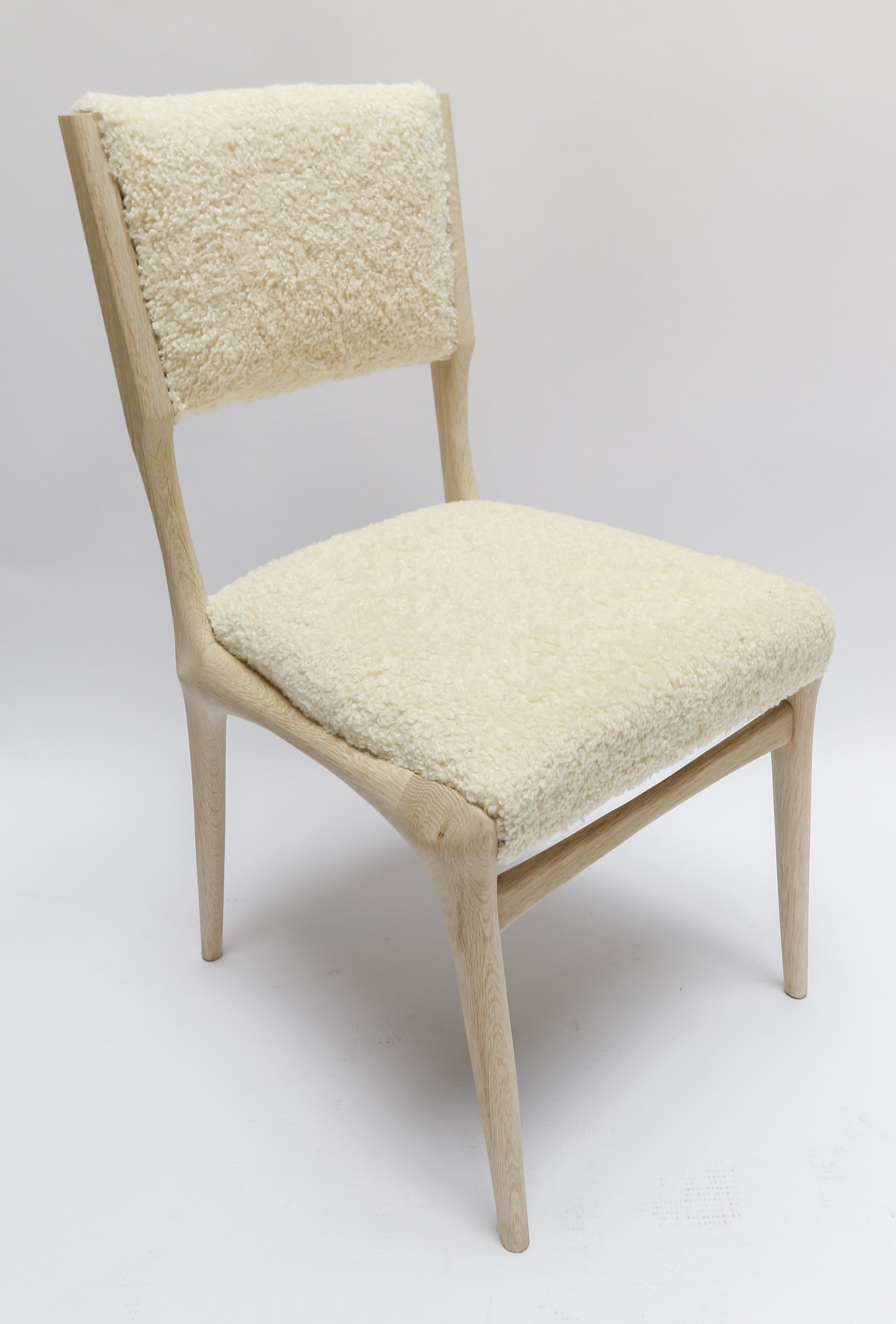 Custom midcentury style dining chair in ivory bouclé. Made in Los Angeles of American oak.  Can be done in different wood and fabrics.