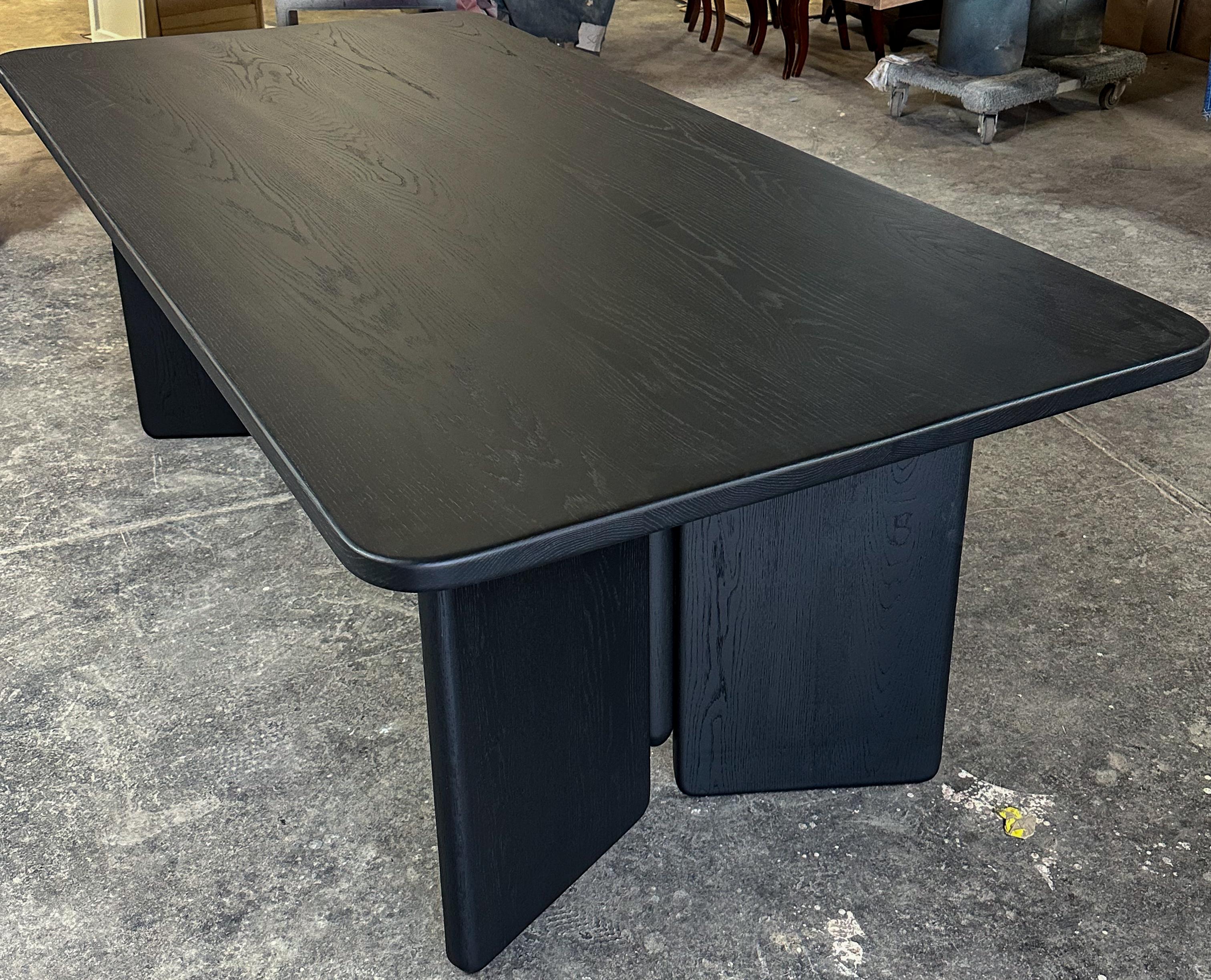 Custom rectangular dining table with two pedestal legs made in black matte brushed American oak.  Made in Los Angeles by Adesso Imports.
Can be done in different woods, finishes and sizes.