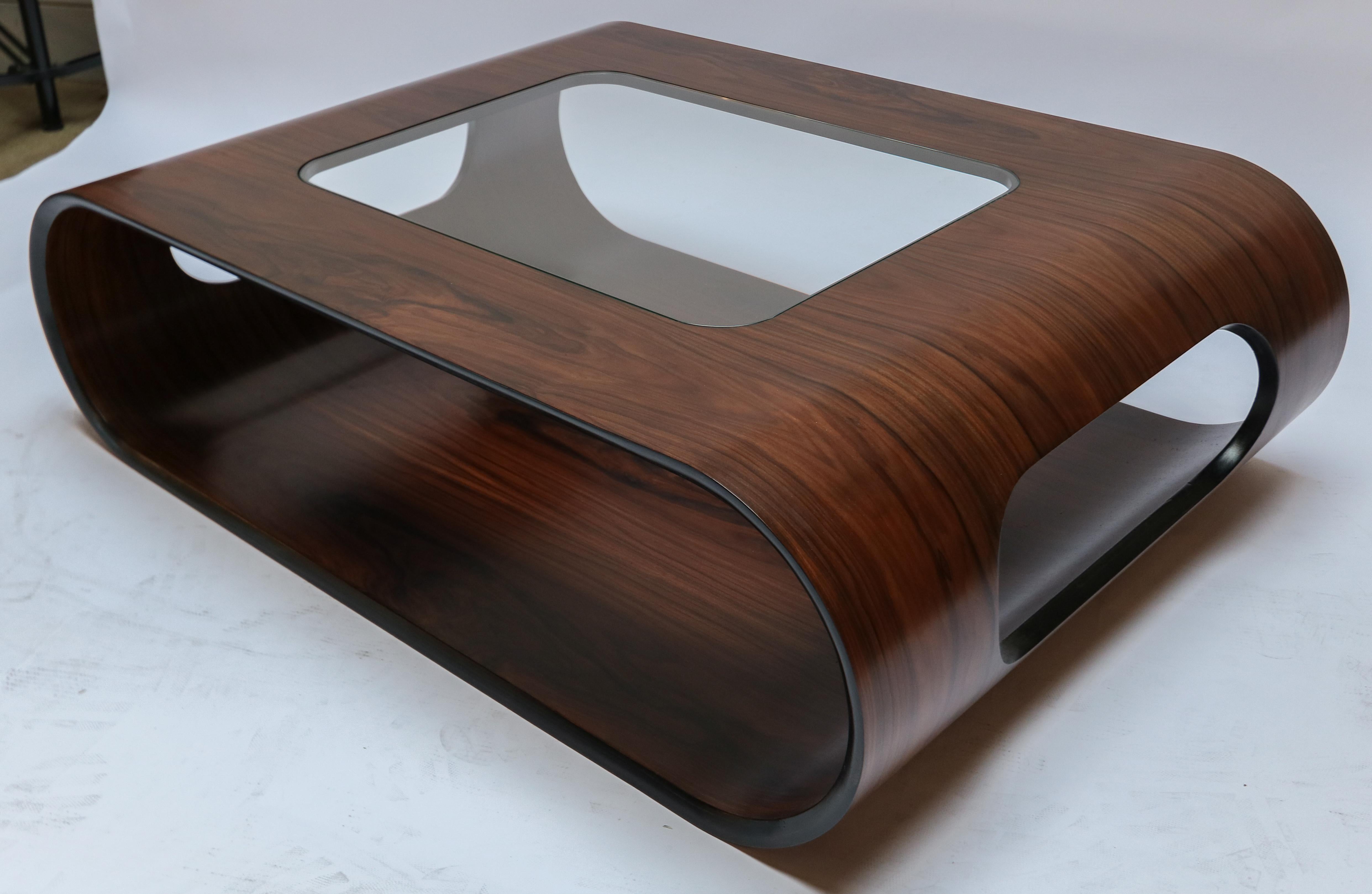 Custom midcentury style curved rosewood coffee table with inset glass top.  Made in Los Angeles by Adesso Imports.

Can be done in different sizes and woods.