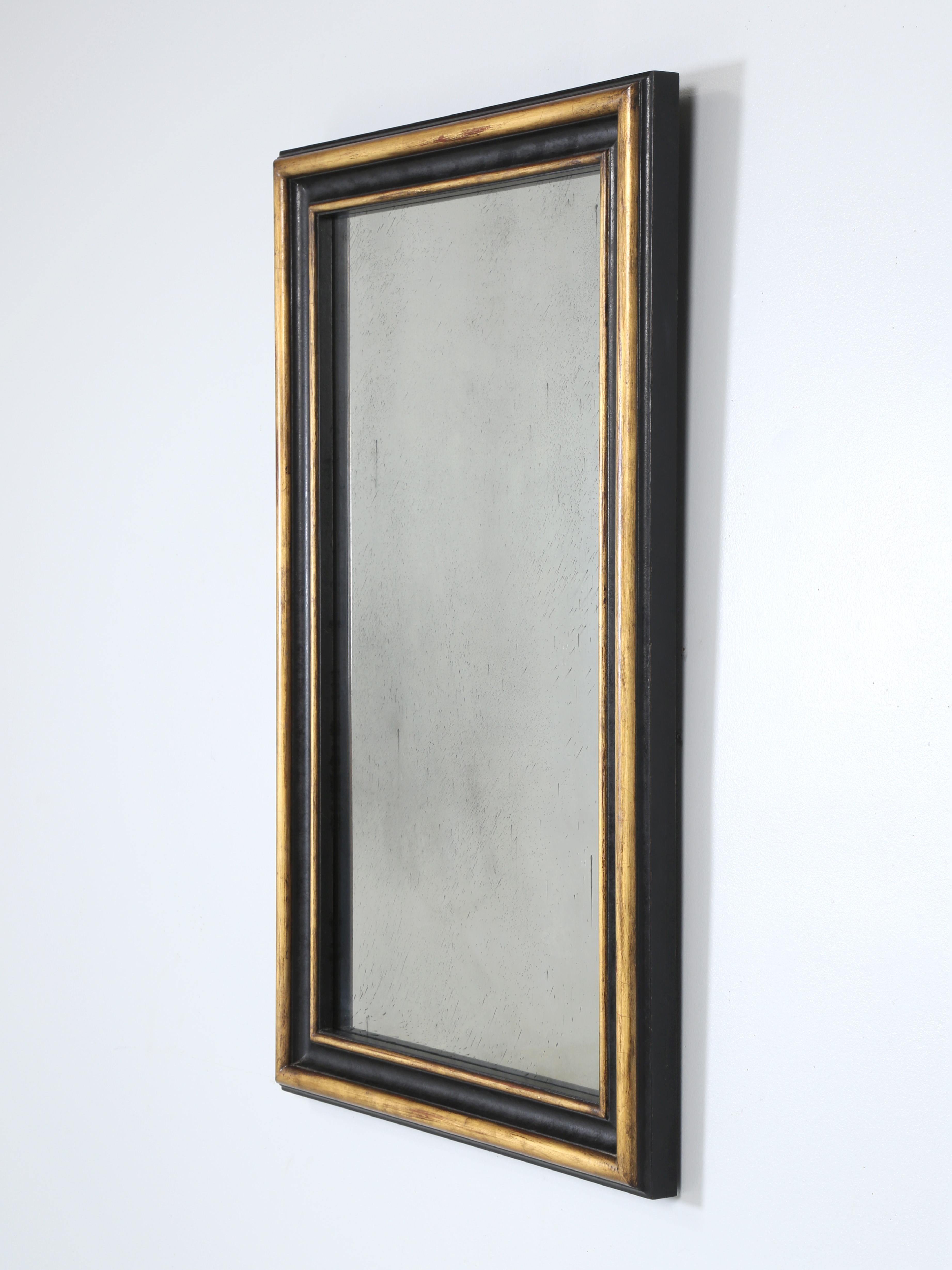 Custom Hand-Made Aged Mirror by our inhouse Old Plank workshop. The Mirror profile was copied from a 19th century original french Mirror we had in stock and since everyone seemed to love the bulk of the frame we decided to make a few. The gold is