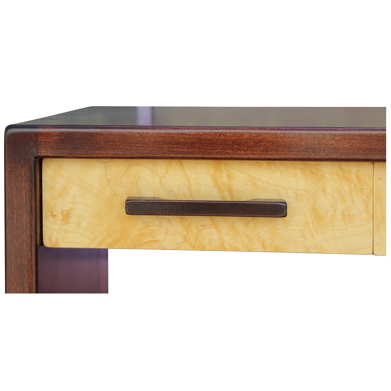 Wonderful high quality custom made 3 drawer desk by Norm Stoeker in Houston Texas. This desk or entry table has been thoughtfully crafted out of three kinds of wood. The outer shell features hand cut dove tail joinery. Three drawer fronts are made