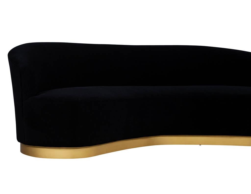 Custom modern black velvet sofa with gold leaf base. Carrocel Custom made sofa with stunning flowing curves sitting on a gold curved base. Can be custom ordered to your preferred measurements.

Price includes complimentary scheduled curb side