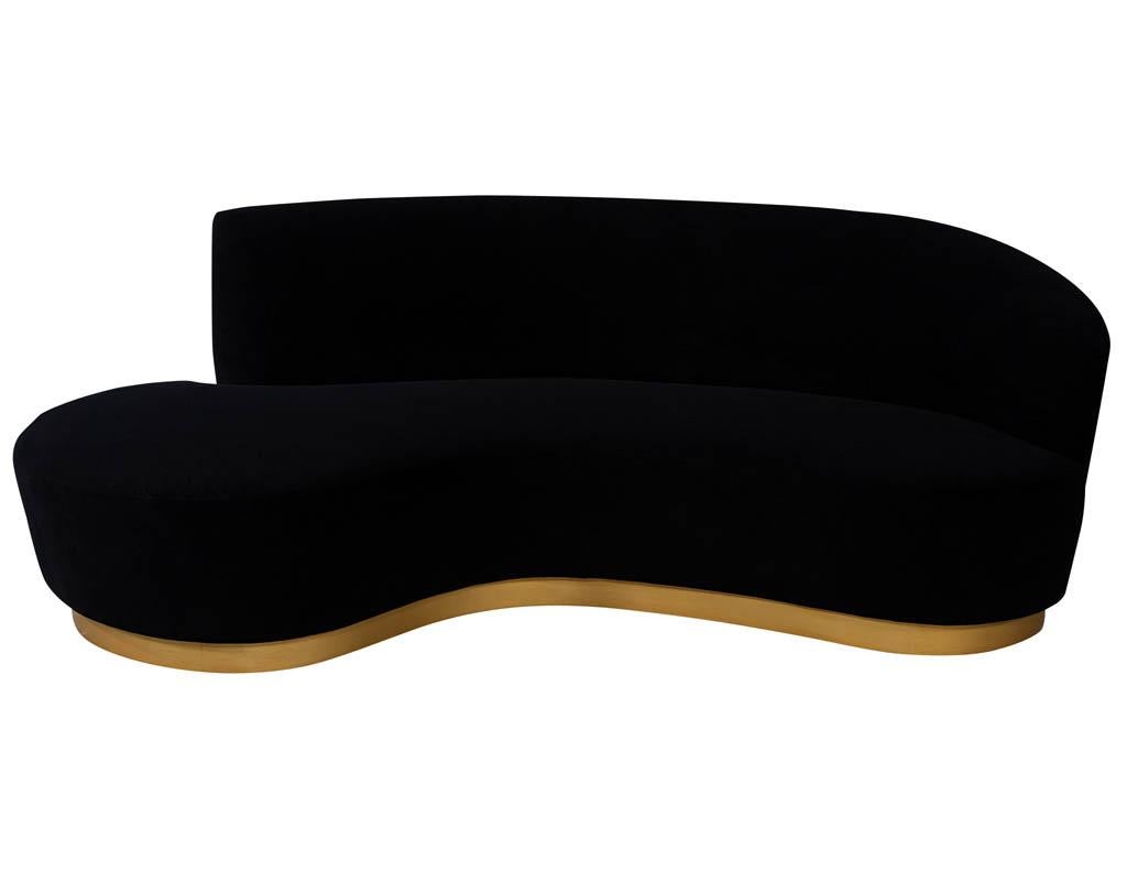 Custom modern black velvet sofa with gold leaf base. Carrocel Custom made sofa with stunning flowing curves sitting on a gold curved base. Can be custom ordered to your preferred measurements.

Price includes complimentary scheduled curb side