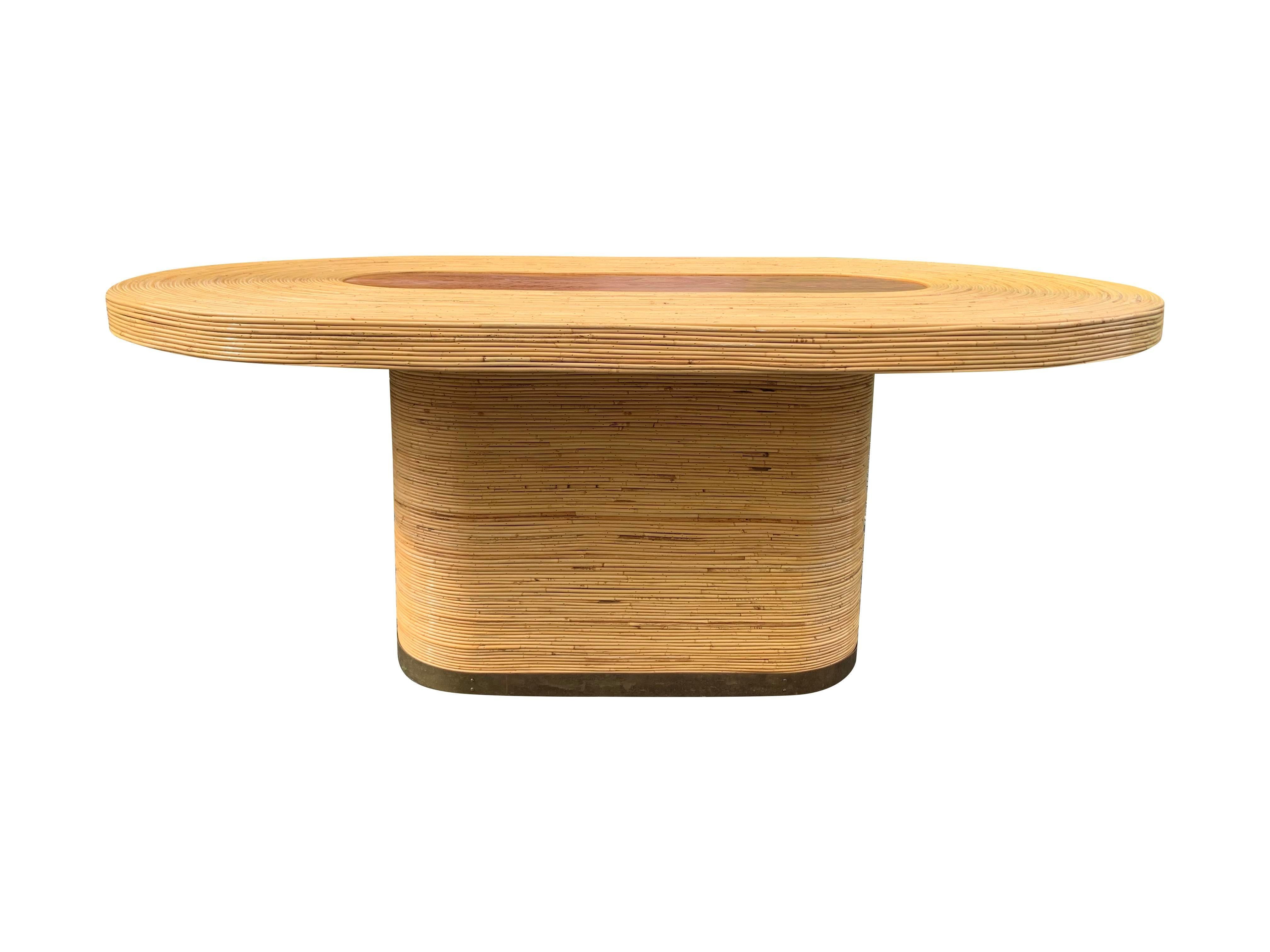 Custom Vintage Rattan Wrapped Dining Table with Brass Base

This unique piece was custom designed in the 1980s and comes from the original owner's estate. It’s a quality item in excellent condition, and it has been kept in a clean, smoke-free, and