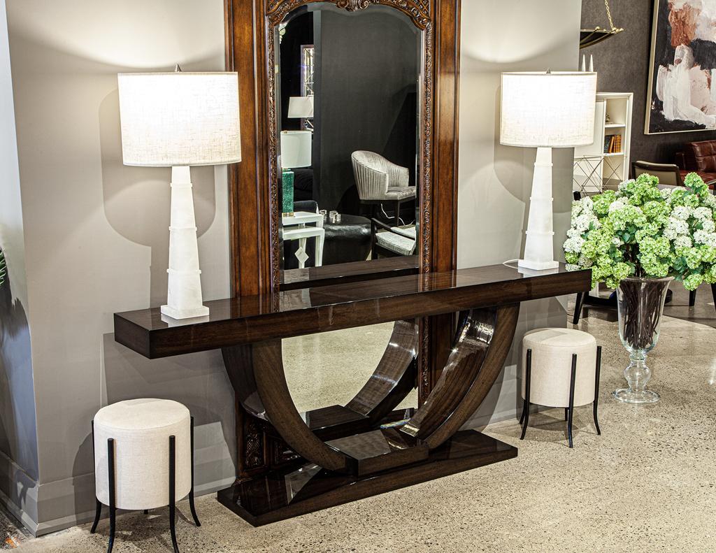 Introducing the newest addition to our collection of modern furniture, the custom art deco inspired console table. Hand-crafted with precision and care in Canada, this console table is a true work of art. Made from the finest quality walnut wood,