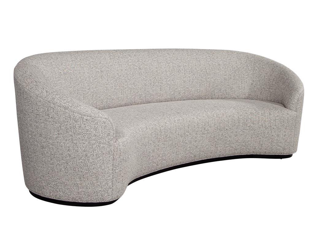 Custom modern curved sofa in grey textured linen. Designed and handcrafted here at Carrocel in Toronto Canada. A true masterpiece of design and styling. This sofa is made to order with lead times of 10-12 weeks.

Price includes complimentary