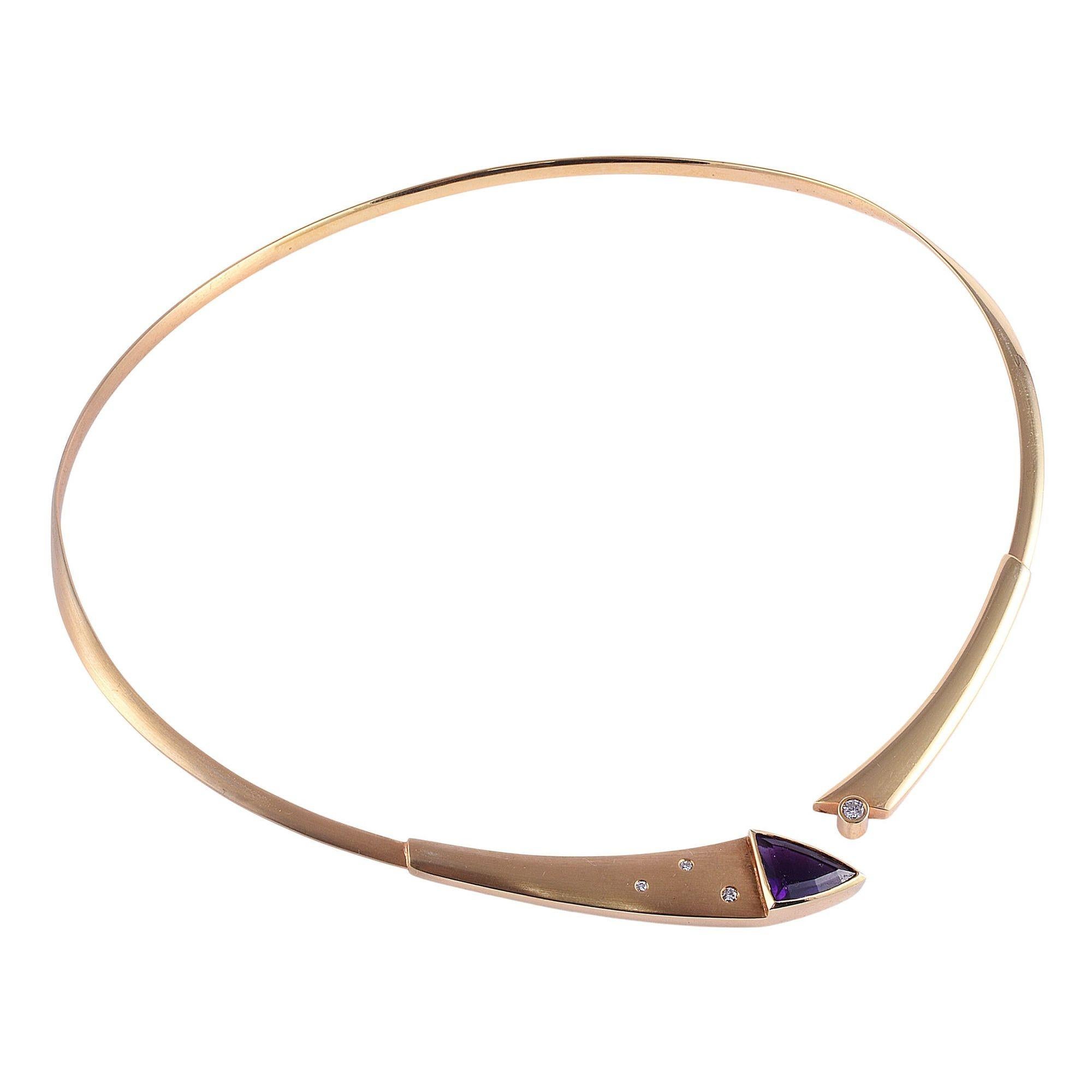 Estate custom modern design amethyst collar necklace. This striking collar necklace is of custom modern design is crafted in 14 karat yellow gold featuring a custom cut amethyst accented with diamonds. [KIMH 642]

Dimensions
Fits 16-17.5