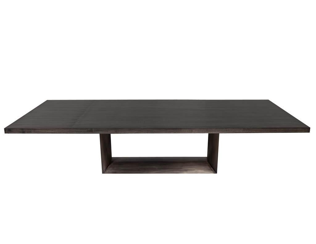 Carrocel custom made dining table with a gunmetal rounded geometric metal pedestal. Featuring a rich polished walnut top in a cold grey tone. Can be custom ordered.

Price includes complimentary scheduled curb side delivery to the continental USA.