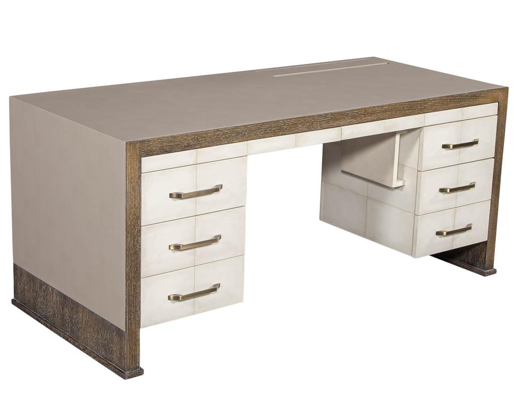 Custom faux leather wrapped modern executive desk. Exclusive Carrocel custom made executive desk with parchment finished drawers and handstitched designer faux leather cladding. Highlighted with a ceruse oak accent. Features 6 full size drawers, 4