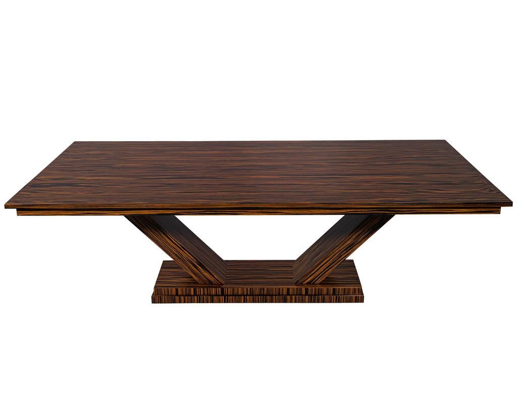 Custom modern macassar dining table by Carrocel. Featuring beautiful Macassar wood grains and clean art deco styling. Completed in a rich natural hand rubbed finish.

Price includes complimentary scheduled curb side delivery service to the