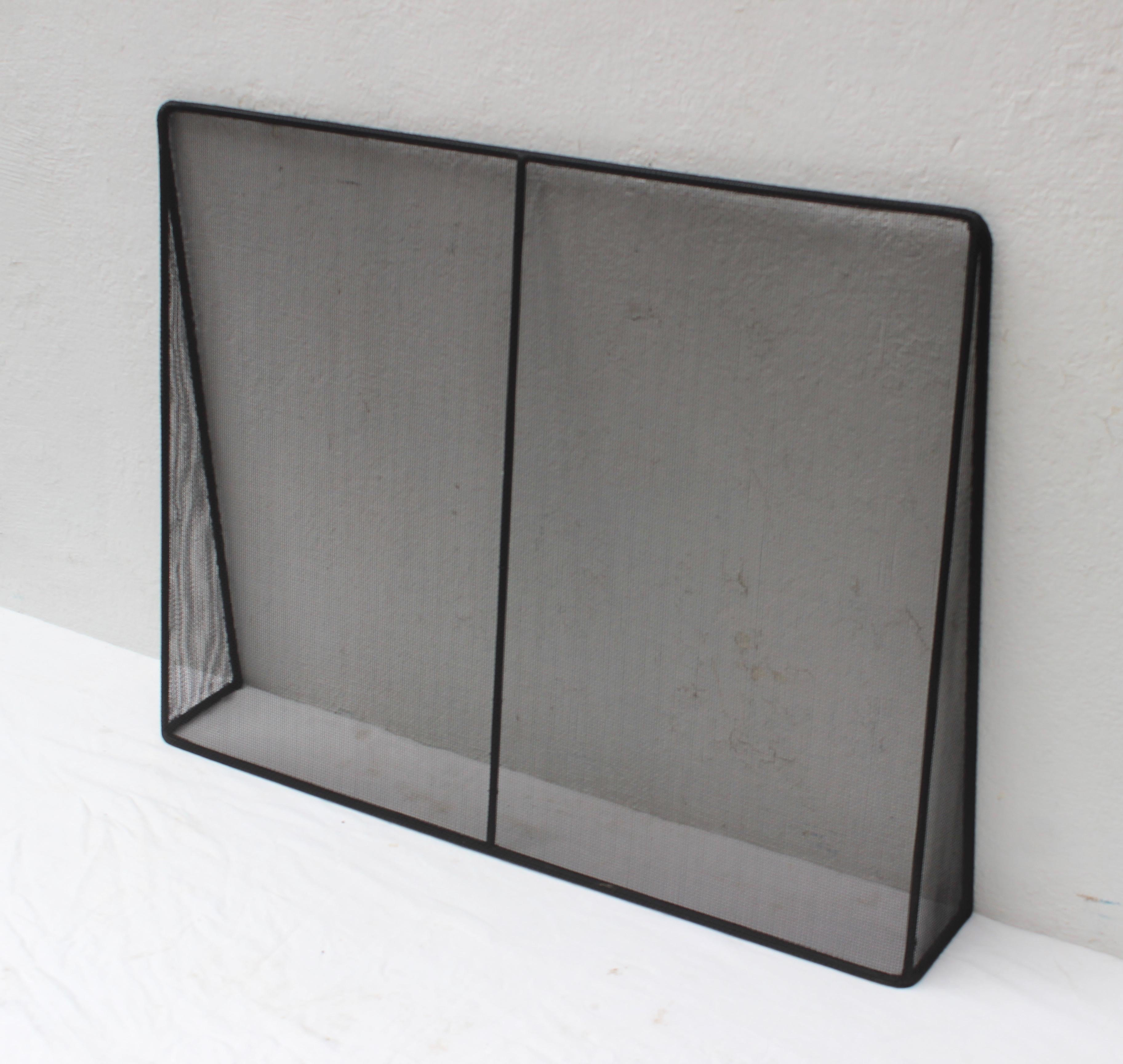 Handcrafted custom modern metal and wire mesh fireplace screen.

Custom sizes.
  