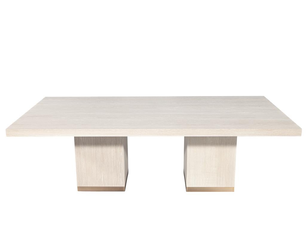 Introducing our exquisite custom modern oak dining table, a stunning centerpiece meticulously hand-crafted from premium oak. Featuring a sleek bleached finish that accentuates the wood's natural grain, this table combines elegance with contemporary