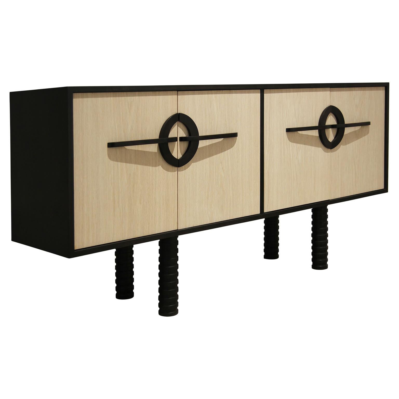 Custom modern organic carved two-tone natural and black sideboard handmade in Houston, Texas by Reeves Art + Design. The legs are hand turned out of oak featuring a ribbed look. The handles have an organic shape which were hand carved and stained