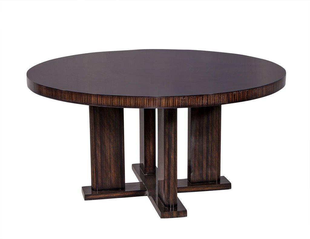 Stunning and sleek, this Macassar ebony dining table is a custom Carrocel piece. Scale it larger or smaller, we can build this to the very quarter inch you desire. Designed with heavy proportions and a deco influence, a historic reminiscence