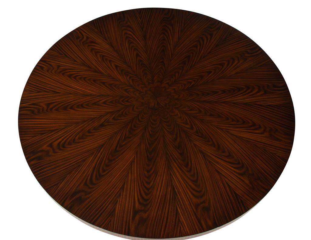 Custom modern round walnut dining table in sunburst pattern. Featuring beautiful sunburst patterned top with round fluted base. Finished in a natural walnut satin finish.

Price includes complimentary curb side delivery to the continental USA.