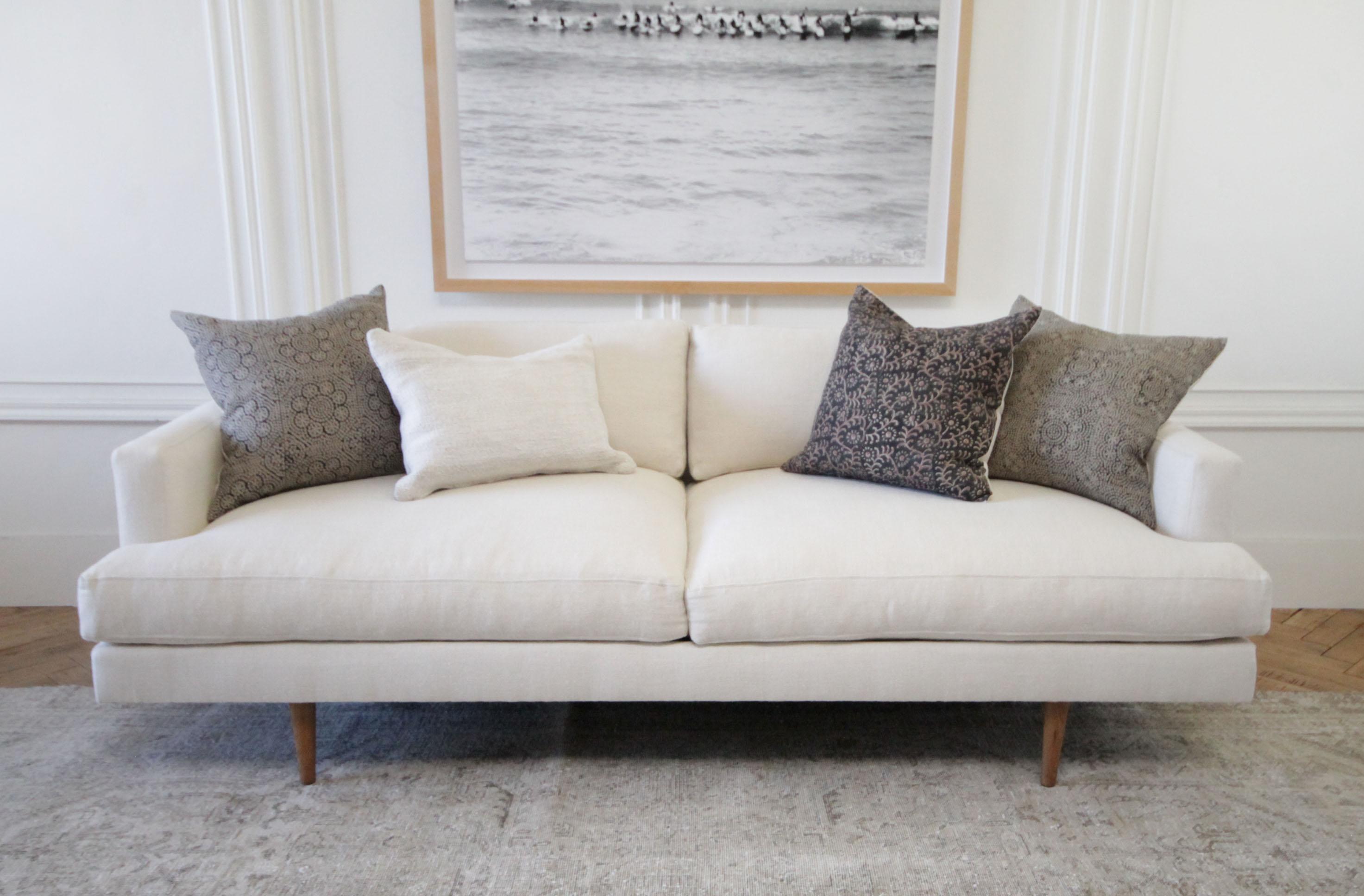 Custom modern Jayson square arm sofa in natural linen with down wrapped seats
Our heavy weight light natural linen is a very light sand color, or oatmeal color. Blends with everything. Modern square arm, with inset Mid-Century Modern style legs in
