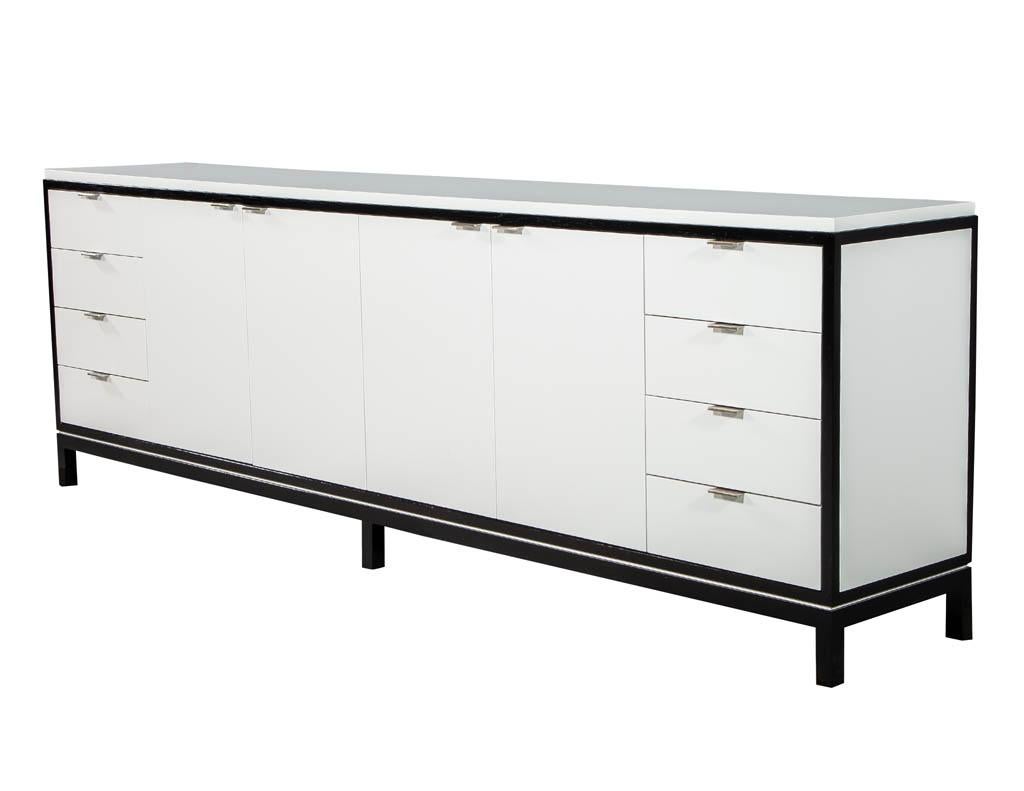 Carrocel custom made sideboard media cabinet with a stone top. Finished with accent espresso wood and designer white lacquer. Cabinet has center doors for storage and side drawers for convenience.
