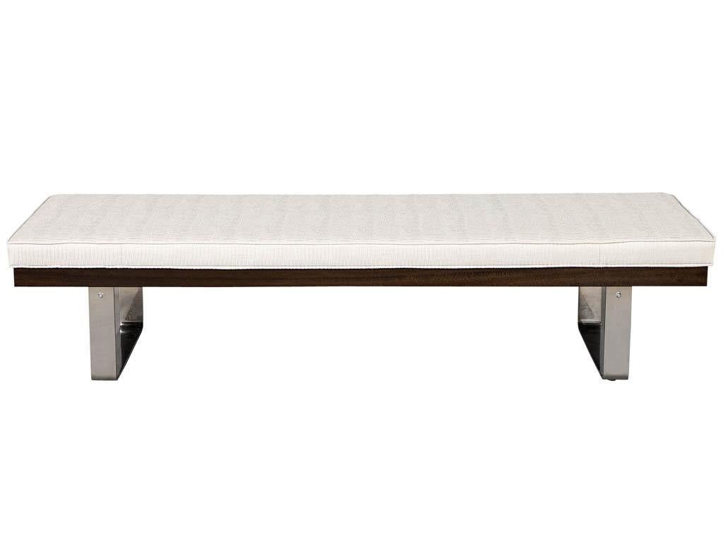 Custom bench with chrome bases a walnut frame, upholstered in a designer fabric.
Price includes complimentary curb side delivery to the continental USA.