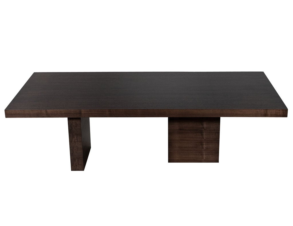 Custom modern walnut dining table with column pedestals by Carrocel. Hand crafted and made to order, simplistic modern styling with clean grain walnut pattern. Thick top with rectangular column pedestals. Finished in a satin dark espresso walnut.