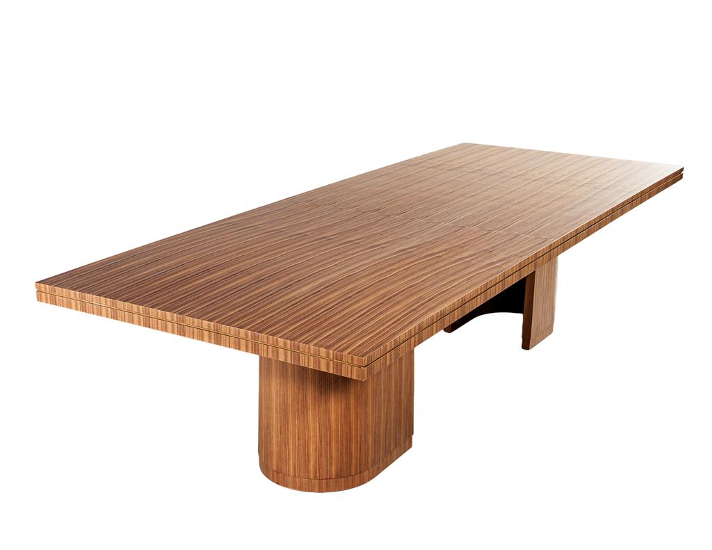 Introducing our Custom Hand-Crafted Walnut Dining Table by the artisans at Carrocel Interiors—a refined statement of modern elegance and exceptional craftsmanship. Made in Canada and meticulously constructed from premium walnut wood, this table